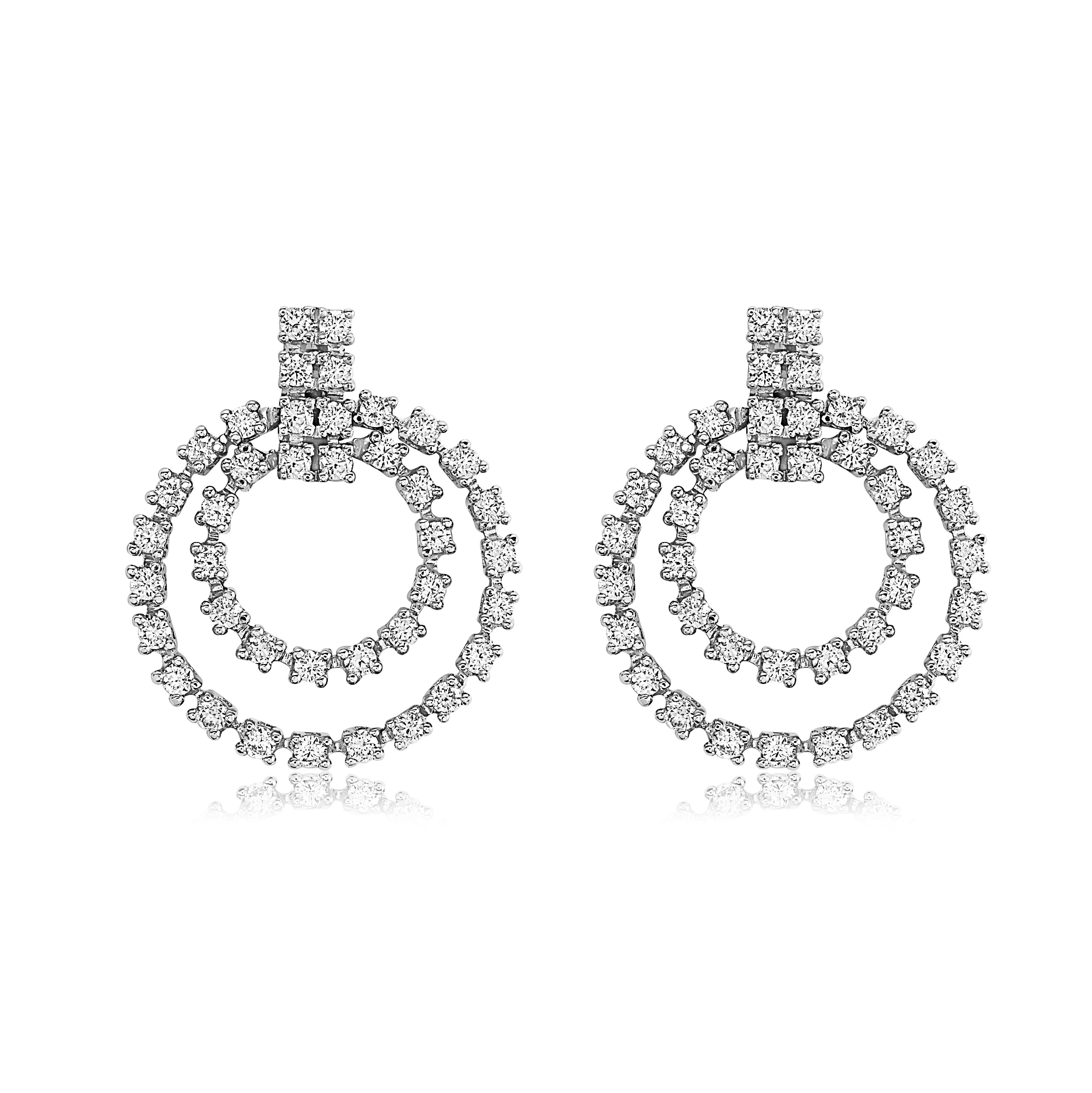 Stunning Krieger Diamond Earrings in 18K White Gold and 2.14 carats of diamonds. These genuine Krieger Diamonds earrings are as timeless as they are beautiful. They elevate any look with the diamonds and gold that sparkle. 

2.14 ct
6.73 dwt

MSRP