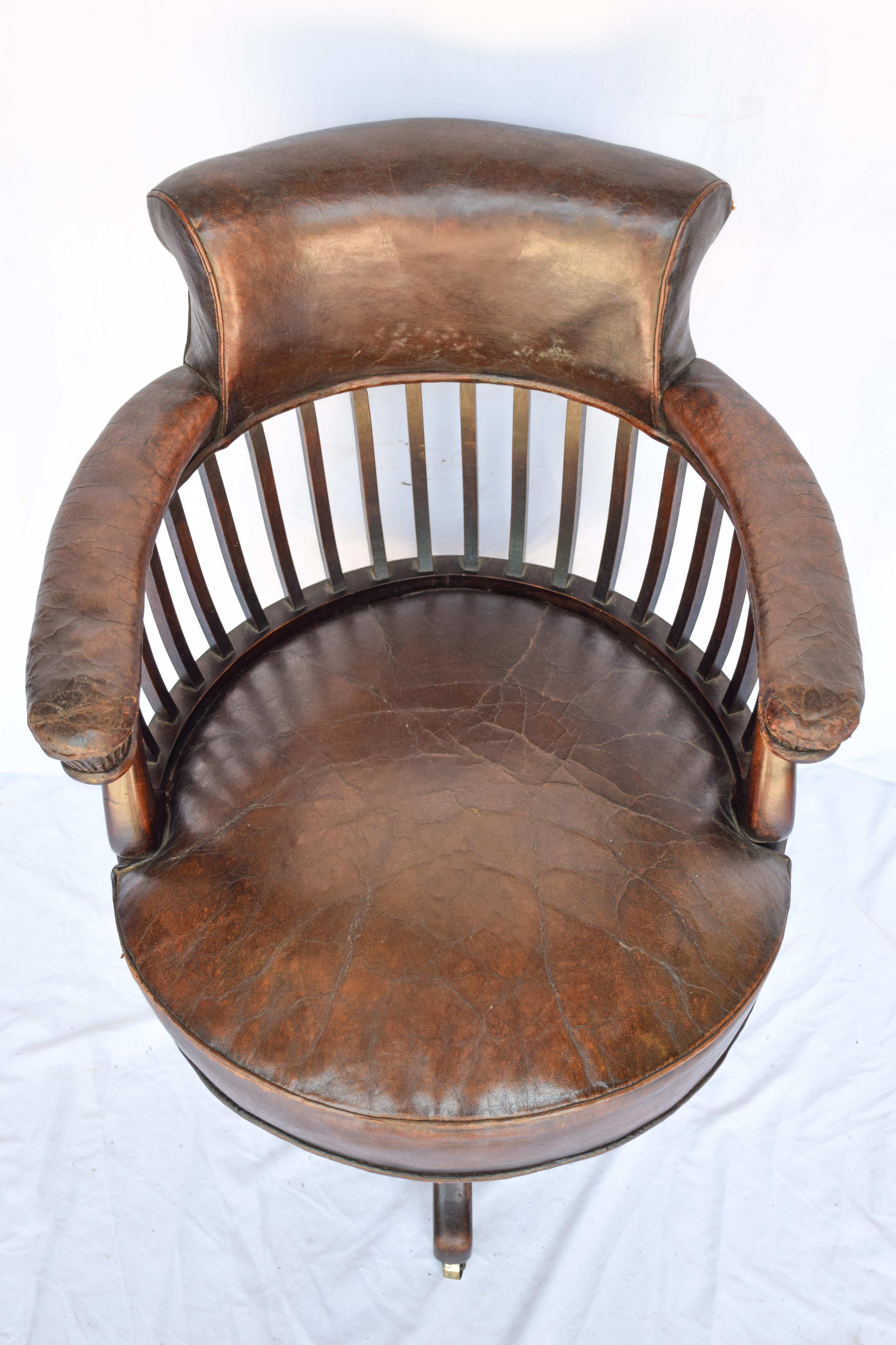 Mason Krieger antique leather mahogany desk chair in good original condition & full of character. The rich leather has a worn and distressed look. This desk chair is comfortable because of its round shape. Perfect for an at home office and sure to