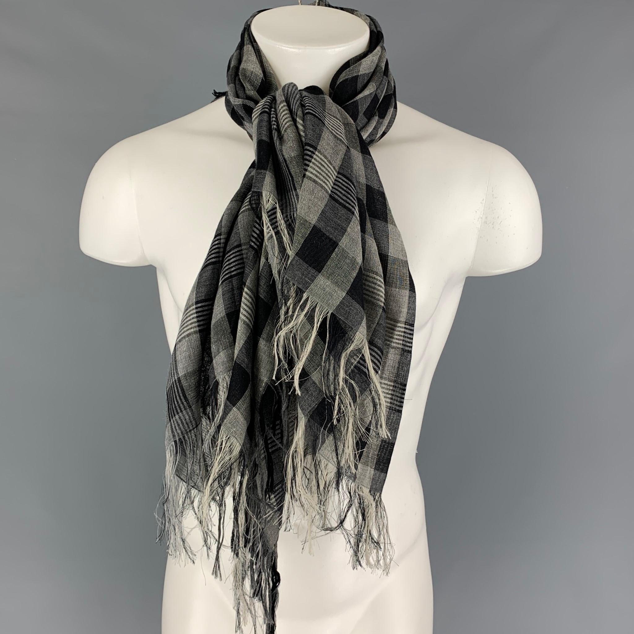 KRIS VAN ASSCHE scarf comes in a grey & black checkered cashmere / line featuring a fringe trim. Made in Italy. 

Very Good Pre-Owned Condition.

Measurements: 50 in. x 50 in.