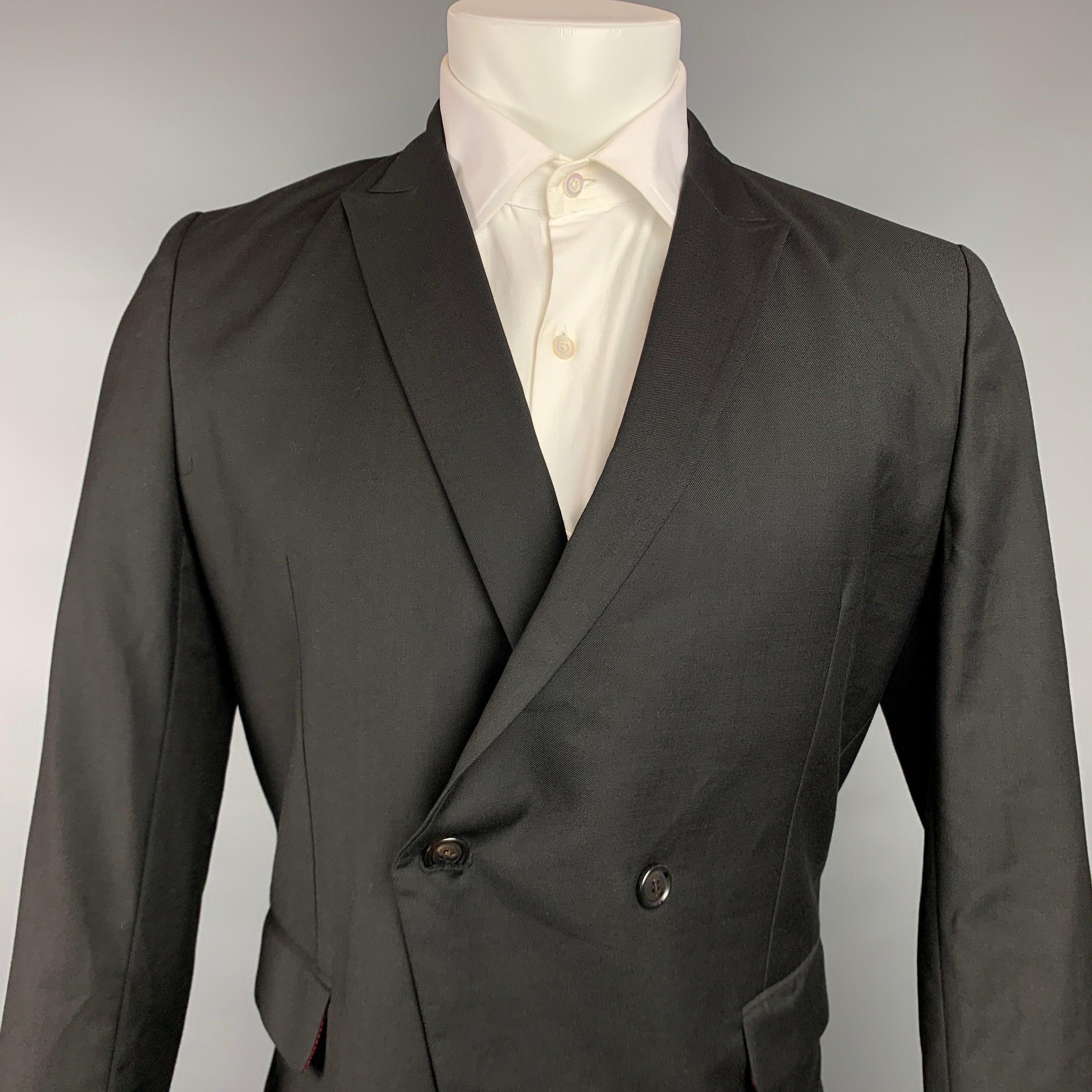 KRIS VAN ASSCHE
sport coat comes in a black wool with a full liner featuring a peak lapel, flap pockets, and a double breasted closure. Made in Italy.Very Good Pre-Owned Condition. 

Marked:   48 

Measurements: 
 
Shoulder: 17 inches  Chest: 38
