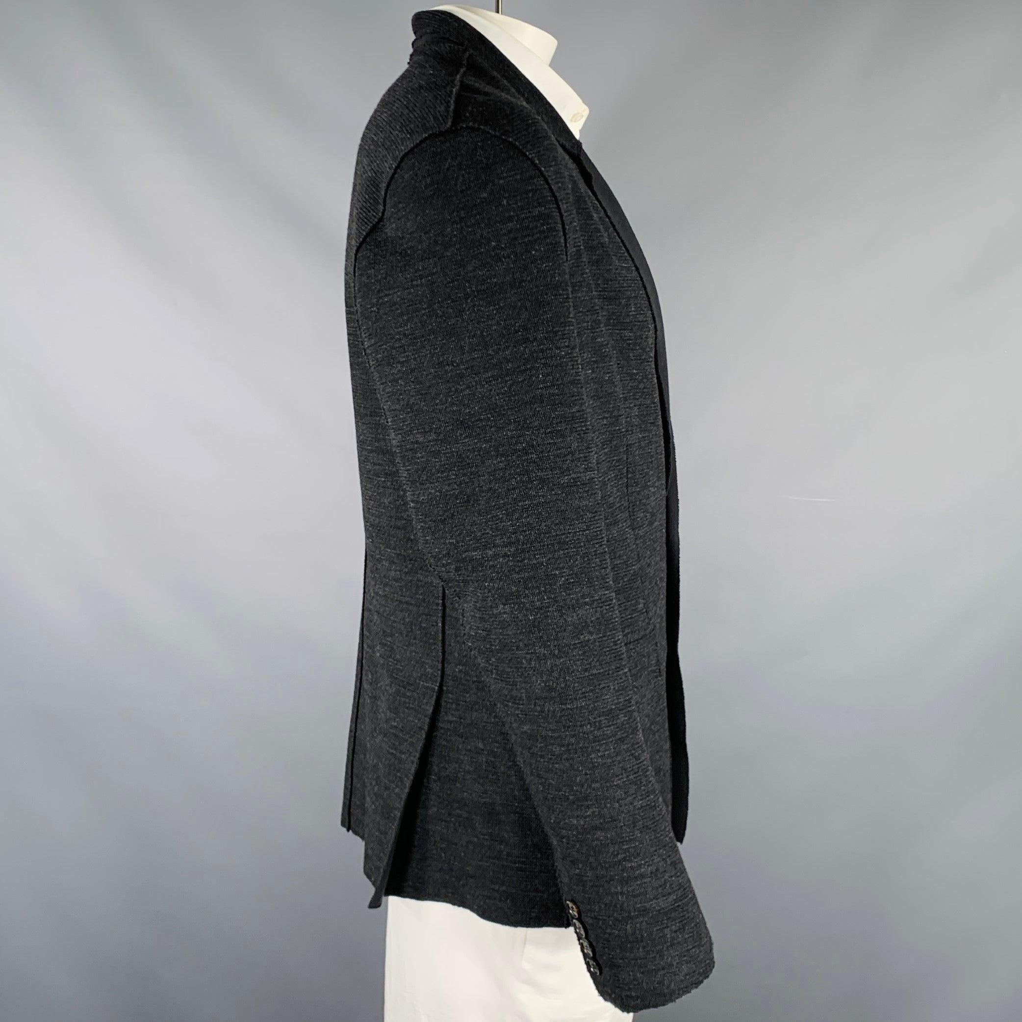 KRIS VAN ASSCHE sport coat
in a black cotton blend fabric featuring a relaxed distressed style, notch lapel, double vented back, and double button closure. Made in Belgium.Excellent Pre-Owned Condition. 

Marked:   52 

Measurements: 
 
Shoulder: