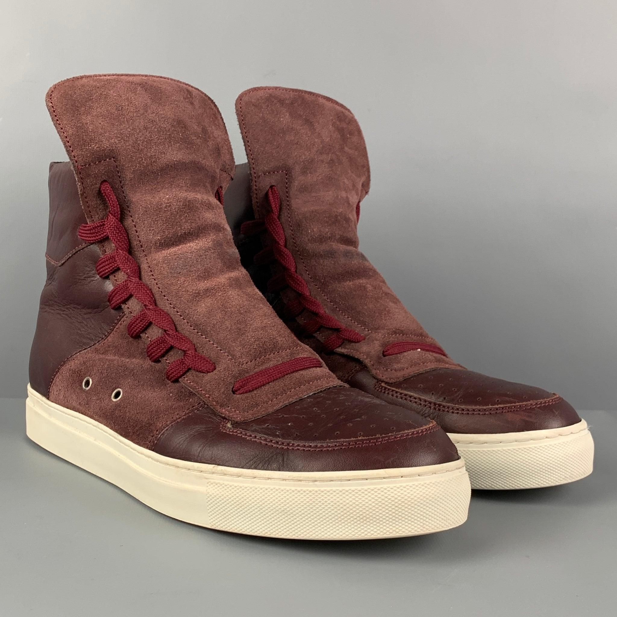 KRIS VAN ASSCHE sneakers comes in a burgundy leather with a suede panel featuring a high-top style, lace up detail closure, rubber sole, and a back zipper closure.
Very Good
Pre-Owned Condition. 

Marked:   42Outsole: 11.5 inches  x 4 inches 
  
  
