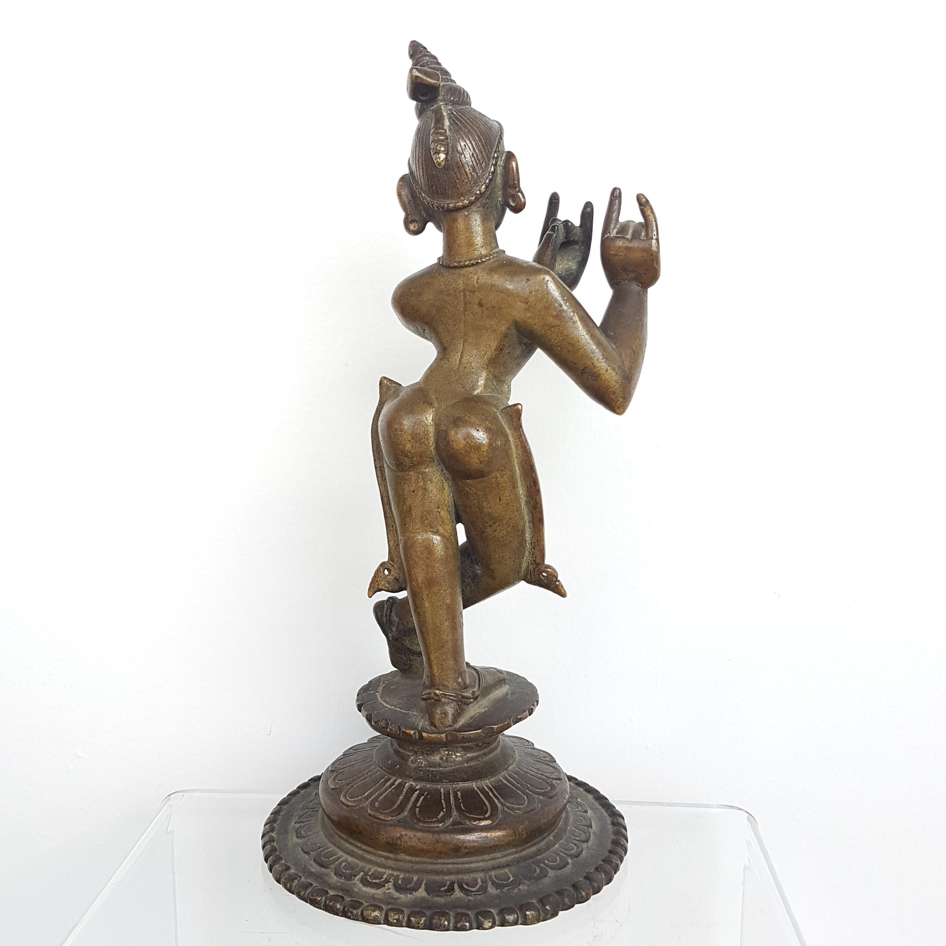 Elegant Krishna Venugopal, bronze figure from Orissa or Bengal, India 18th century. Made from Cire Perdue/(lost wax) technique. Height: 26 cm

Krishna is standing wearing a simple yet elegant Dhoti on a 3-tiered Lotus base, with the circumference