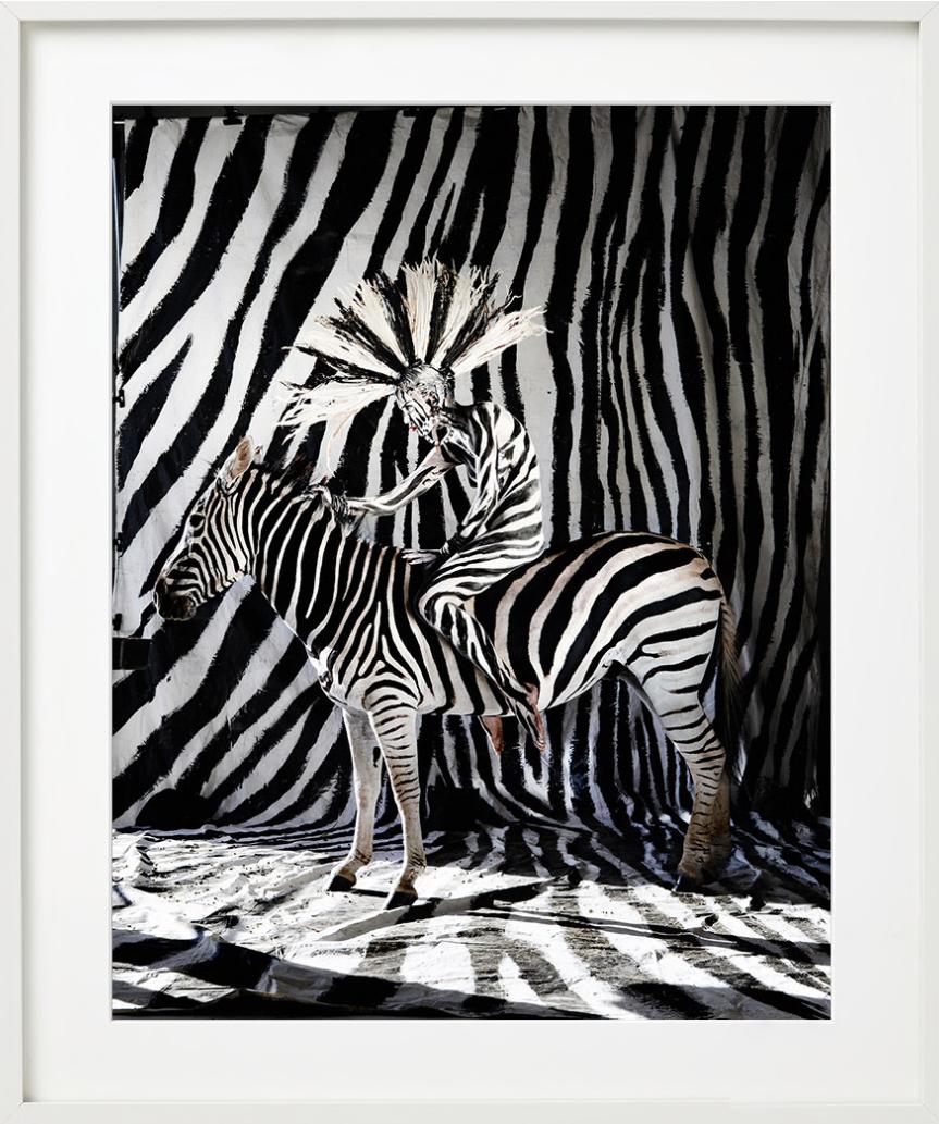 A Nude Model painted in Zebra Stripes sitting on A Zebra, photographed by Kristian Schuller.

All prints are limited edition. Available in multiple sizes. High-end framing on request.

All prints are done and signed by the artist. The collector