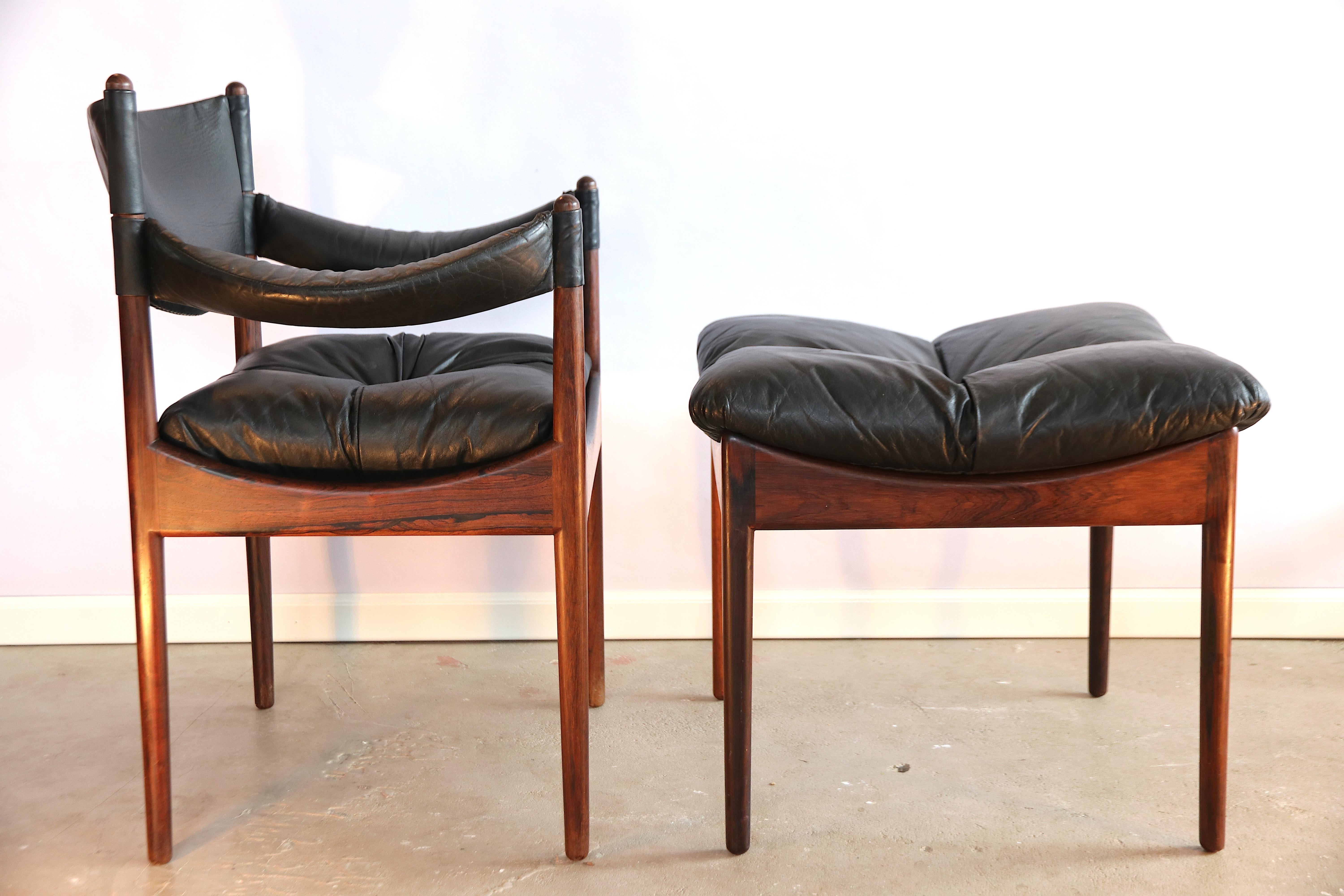 Beautiful set of black leather armchair with the rare matching 1-button tufted hocker or stool by Kristian Vedel, Denmark circa 1963, model Modus from production year 1963. The condition of both is excellent; the color of the 2 rosewood frames match