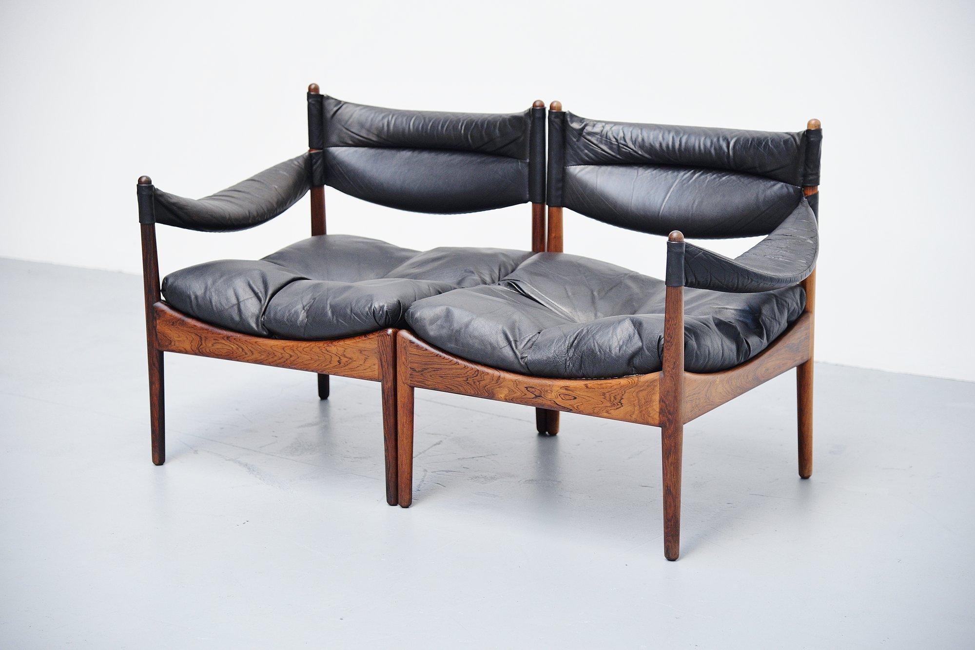 Very small modular 2-seat sofa from the Modus series designed by Kristian Solmer Vedel and manufactured by Soren Willadsen, Denmark 1963. These elements have solid rosewood frames and black leather upholstery. The chairs are in very good original
