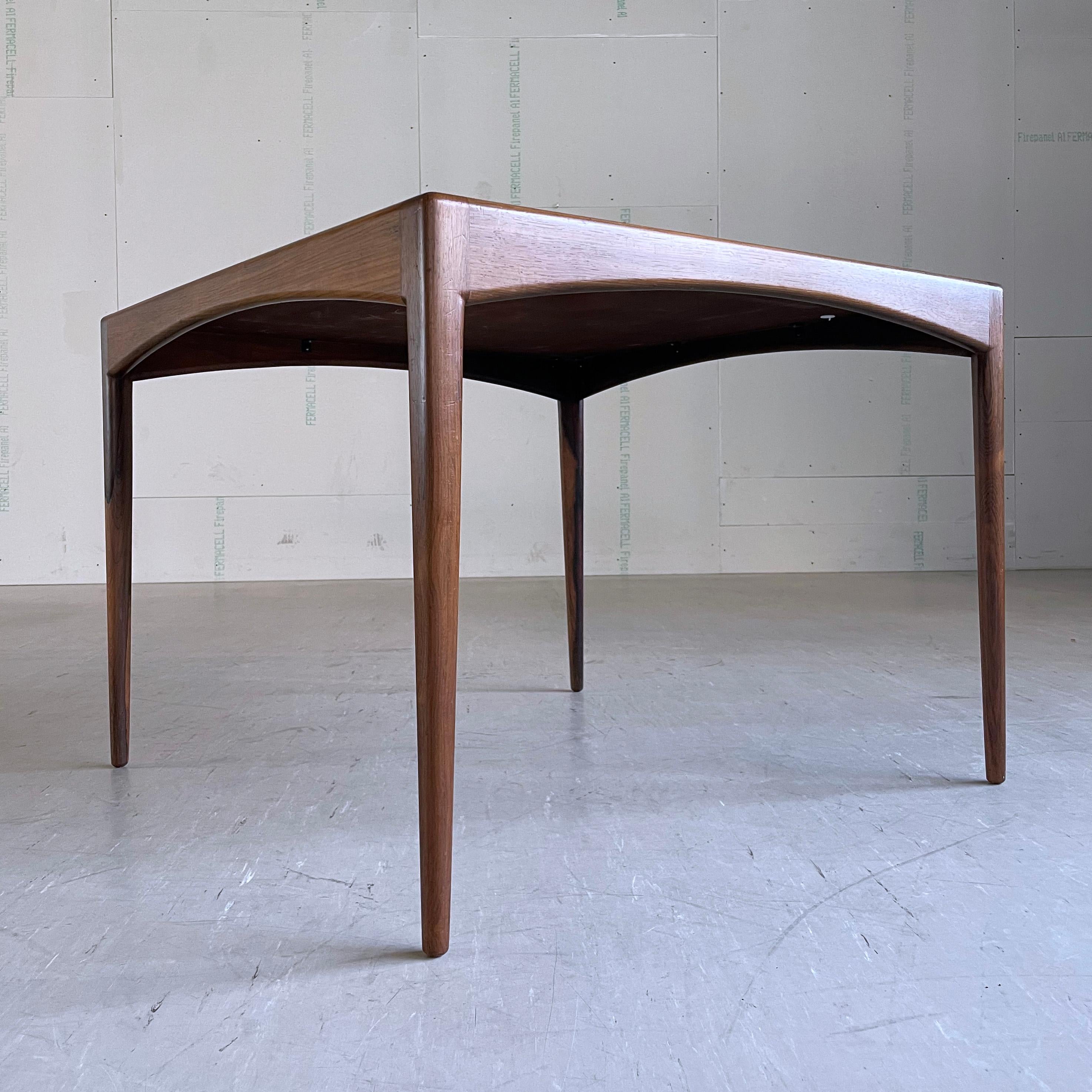 Kristian Solmer Vedel Rosewood Dining Table. Produced by Søren Willadsen, Denmark. Beautiful wood grain and in fantastic condition
Designer: Kristian Sommer Vedel
Producer:  Søren Willadsen, Denmark 1963
Measurements: Height: 66 cm  Width: 90cm 
