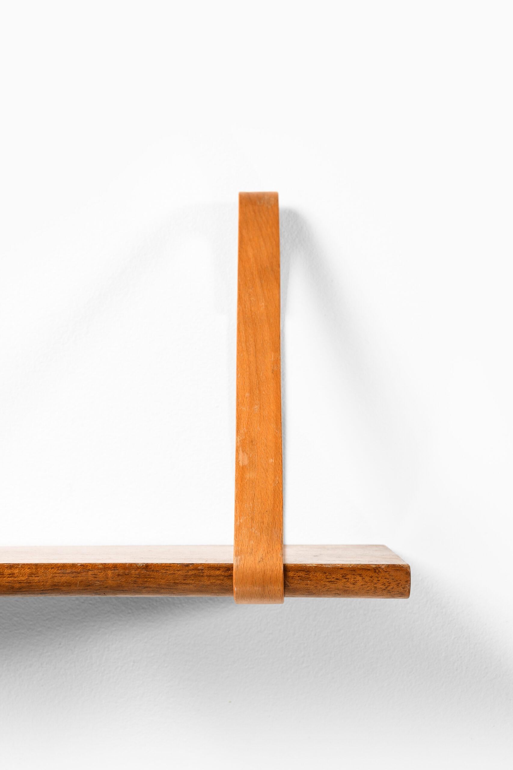 Rare wall shelf designed by Kristian Solmer Vedel. Produced in Denmark.