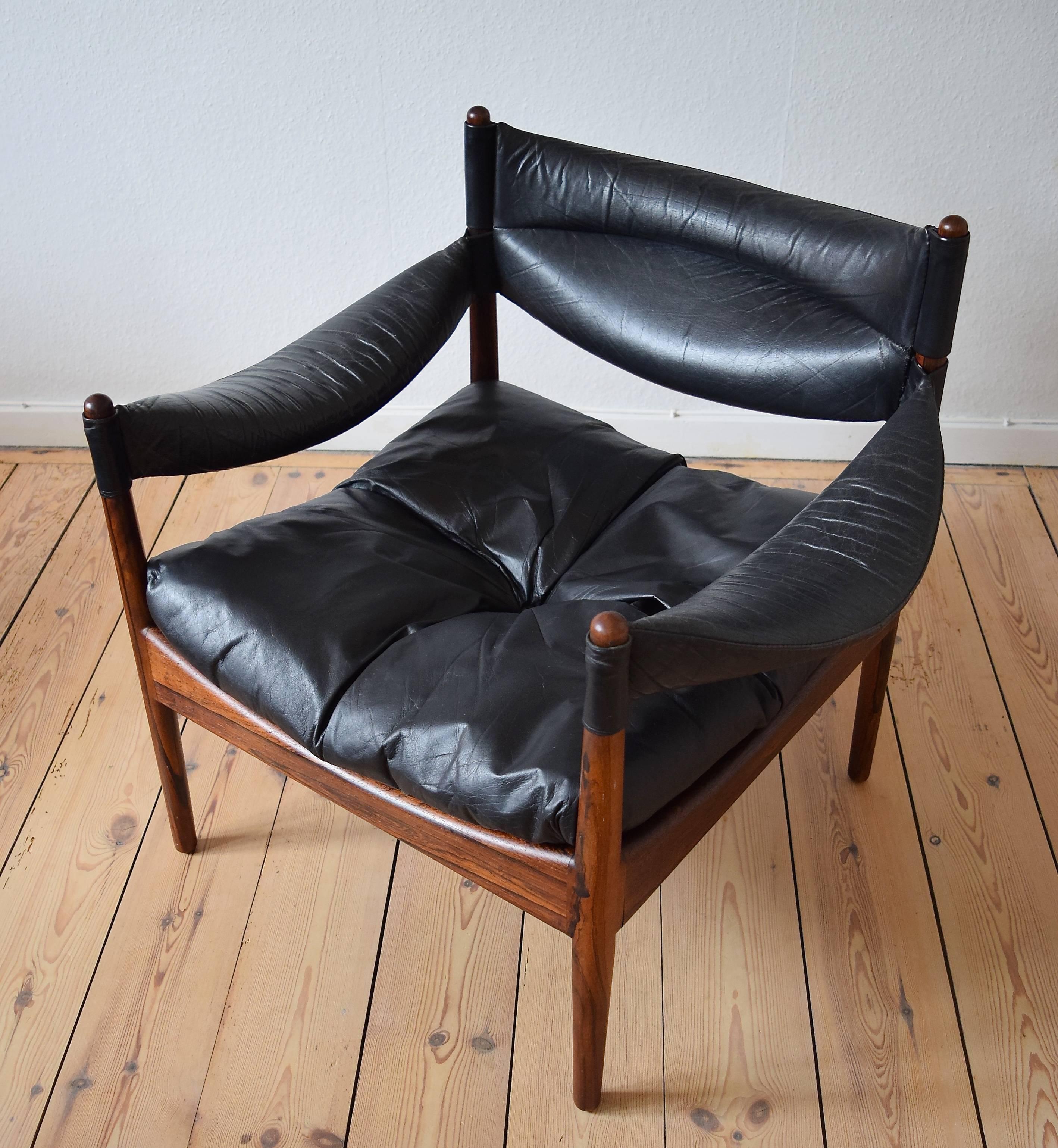Leather and rosewood lounge chair designed by Kristian Vedel for Søren Willadsen, Denmark. This is Vedel's most popular design and came in slightly different variations. This is the low back easy chair. It is quite a departure from most of the other