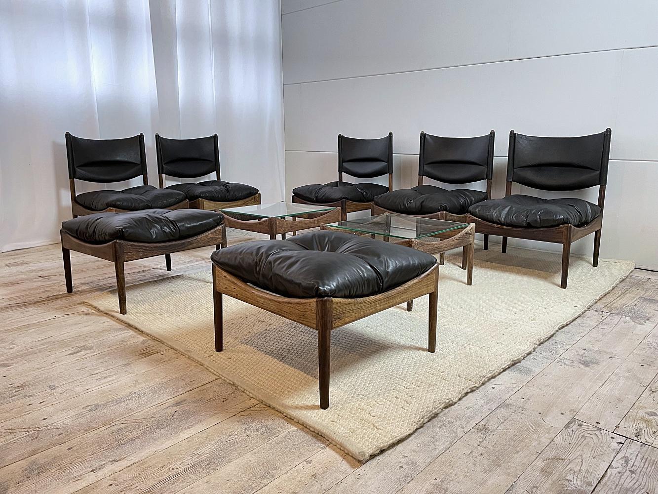 Extraordinary Kriatian Vedel MODUS modular sofa set from 1960s. The set is made of high quality soft leather and beautiful Brazilian Rosewood, typical of Soren Willadsen Mobelfabrik, Denmark. 
The set consists of five fauteuils, two poufs and