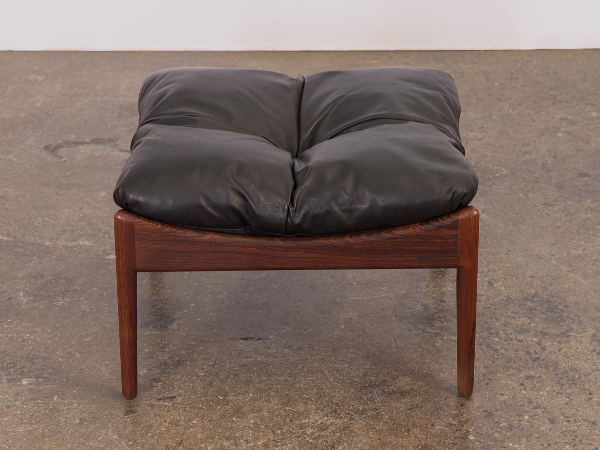 Pretty Kristian Vedel Modus rosewood ottoman from the 1960s. Black tufted leather cushion is in good condition with age-appropriate wear. The rosewood frame is gleaming with a stunning grain attractive from all sides. Upholstery is available upon