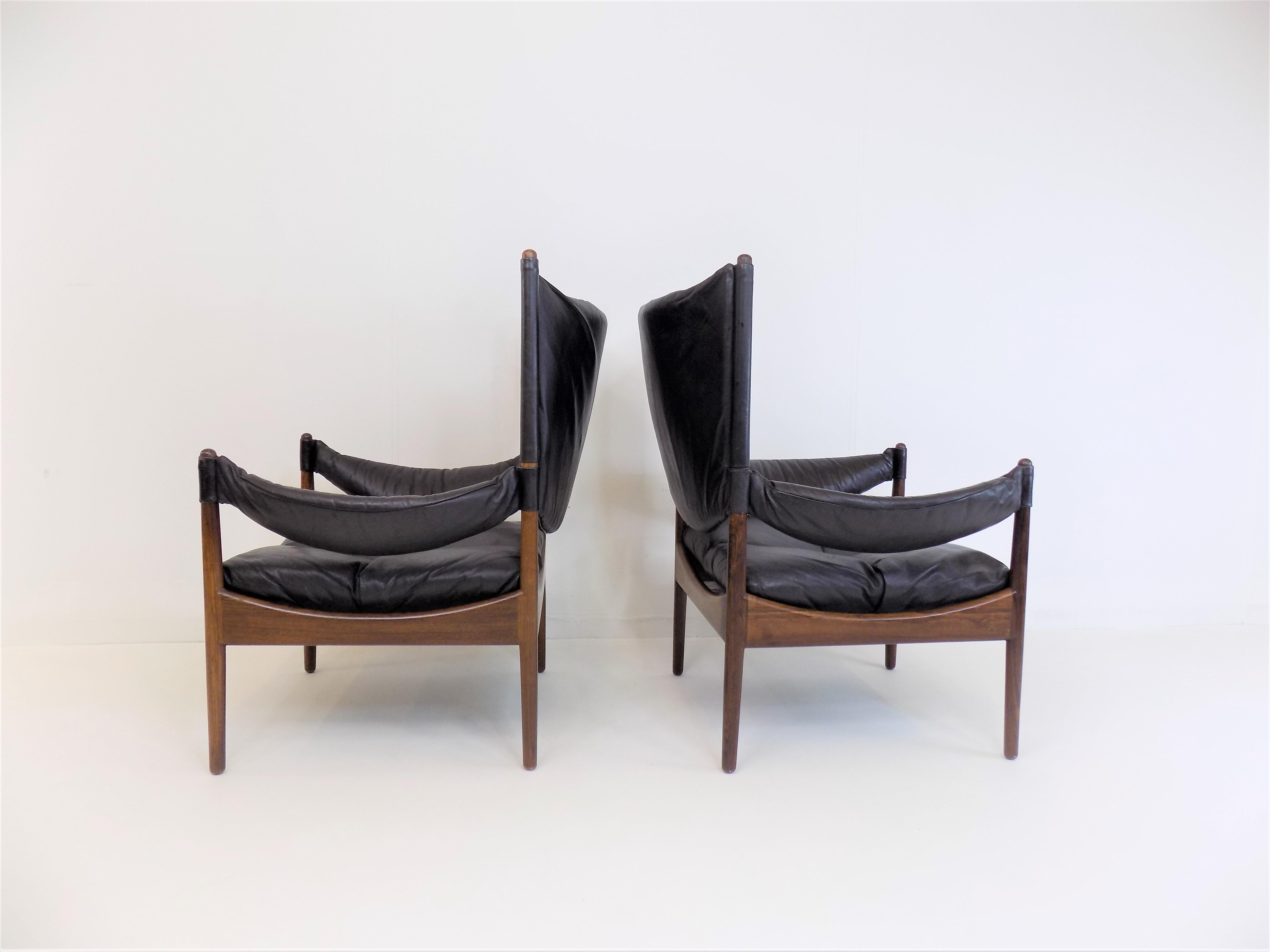 Excellent condition pair of modus armchairs by Kristian Vedel with rosewood frame. The leather of both chairs is in excellent condition, soft with no tears or wear. The rosewood frames have a beautiful grain and show hardly any signs of wear. The