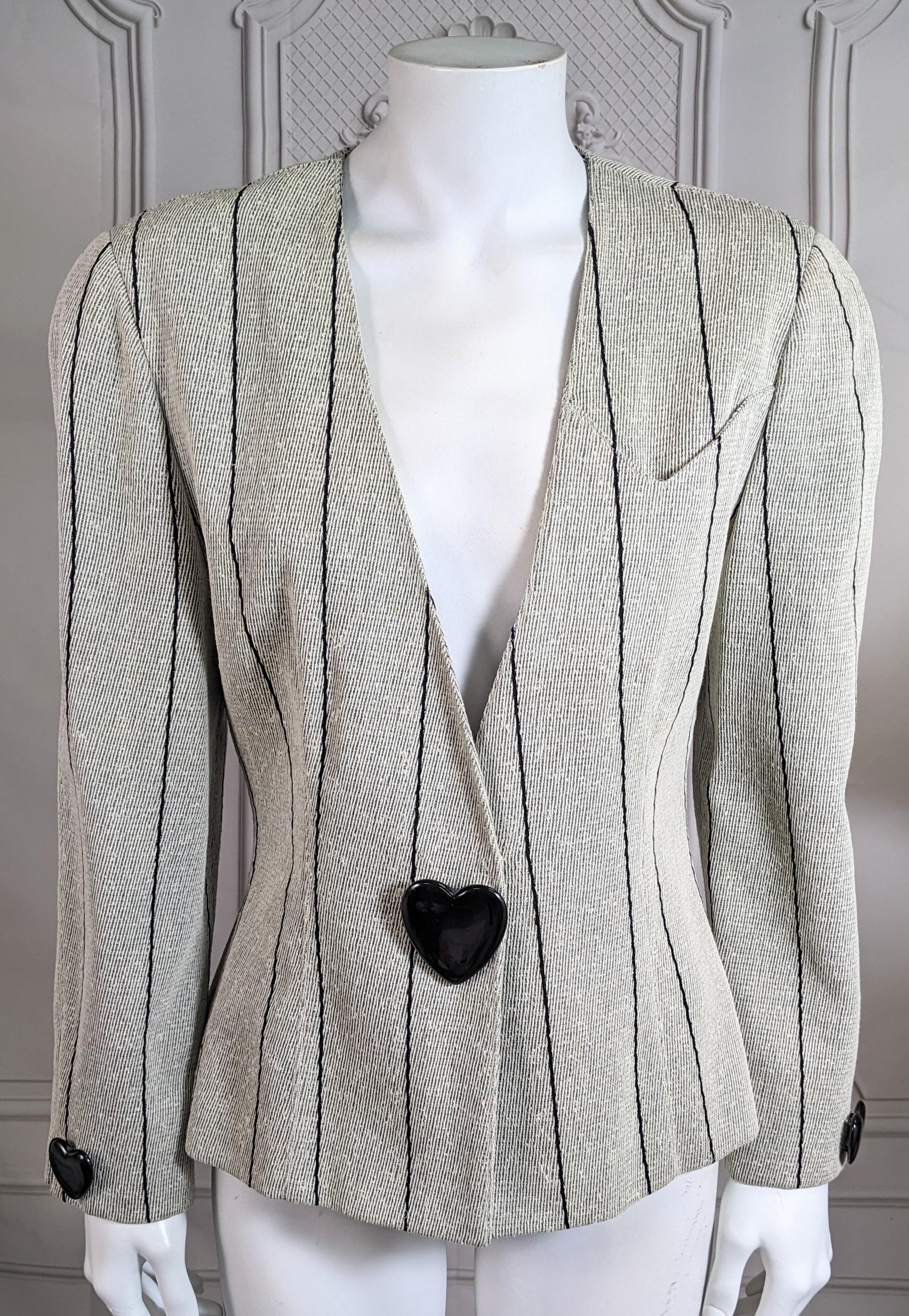 Iconic Krizia linen tweed blazer with black bakelite heart decor. 1980's with strong shoulders and nipped waist. Black bakelite heart motifs are added at waist and cuffs. Charming cleft shaped chest pocket. Perfect accent piece. 1980's Italy. Small