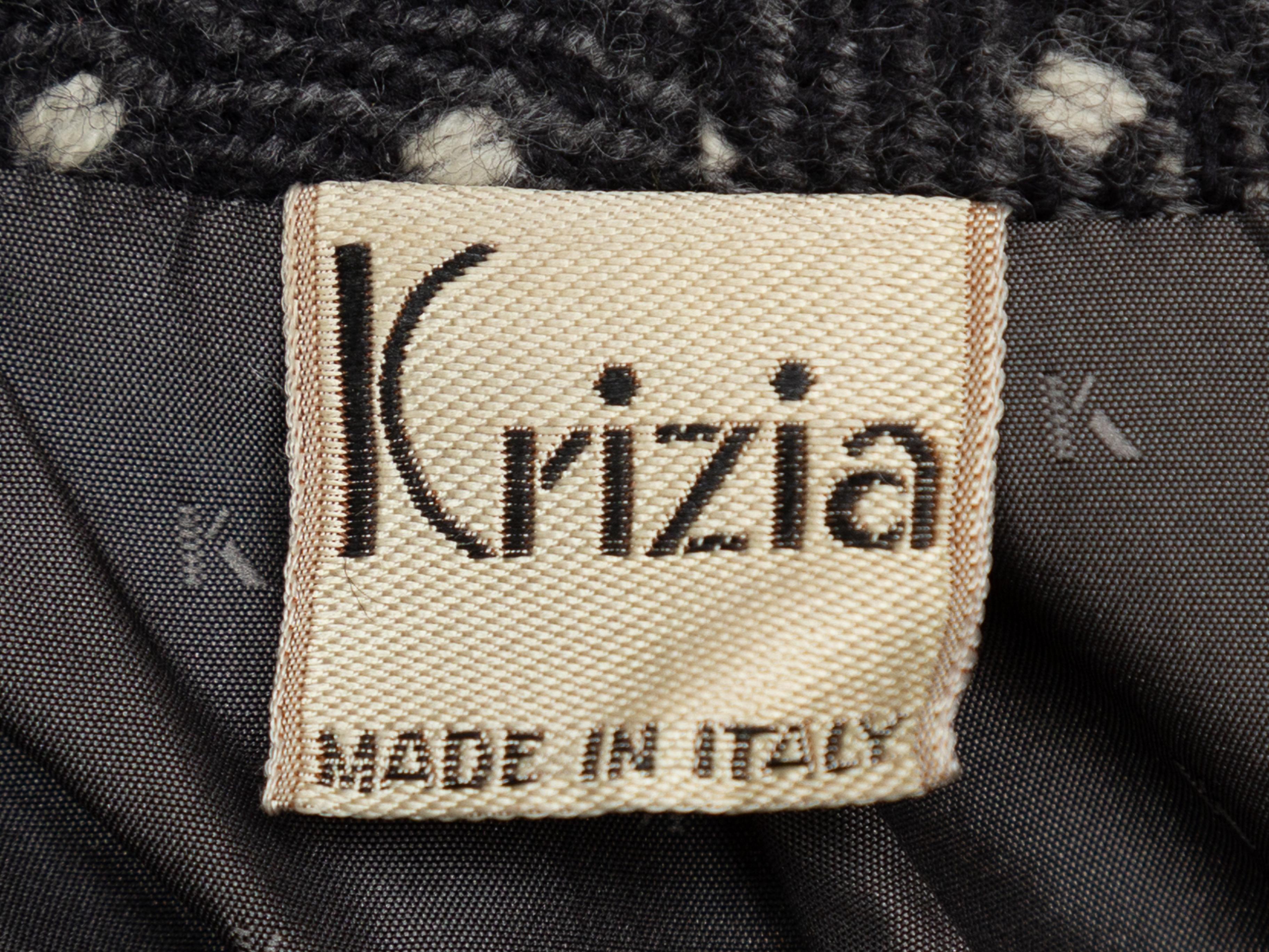 Product details: Vintage grey and white wool jacket by Krizia. V-neck. Dual slit pockets at hips. Button closures at front. Designer size 46. 42