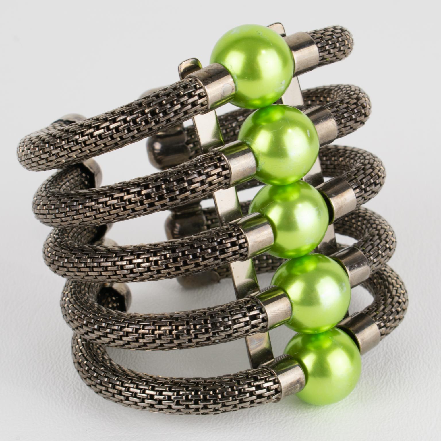 This stunning, Krizia Italy couture bracelet is a rare find. The massive cuff-shaped bangle is made of gunmetal chain links, complemented by huge pearl-like resin beads in a gorgeous chartreuse green color. The marking is inside the bracelet,