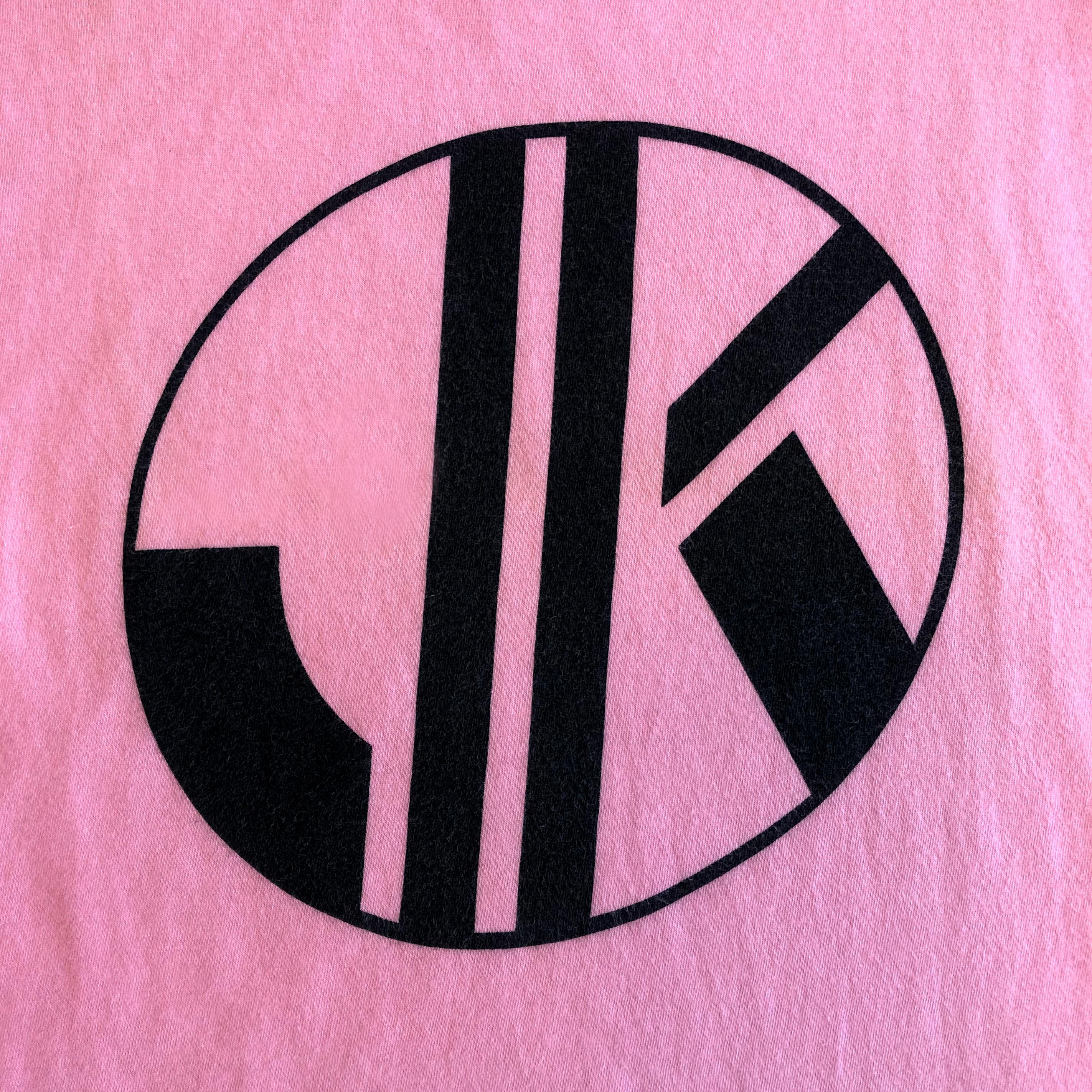 Product Details: Rare - Krizia Jeans - 1980s Vintage - T-Shirt - Cap Sleeve Detail - Ribbed Neckline - Black JK Motif Front T - Plain Back T
Label: Krizia - Jeans
Era: 1980s Vintage
Fabric Content: Pink Cotton / Black Motif
Size: M
Bust Circ