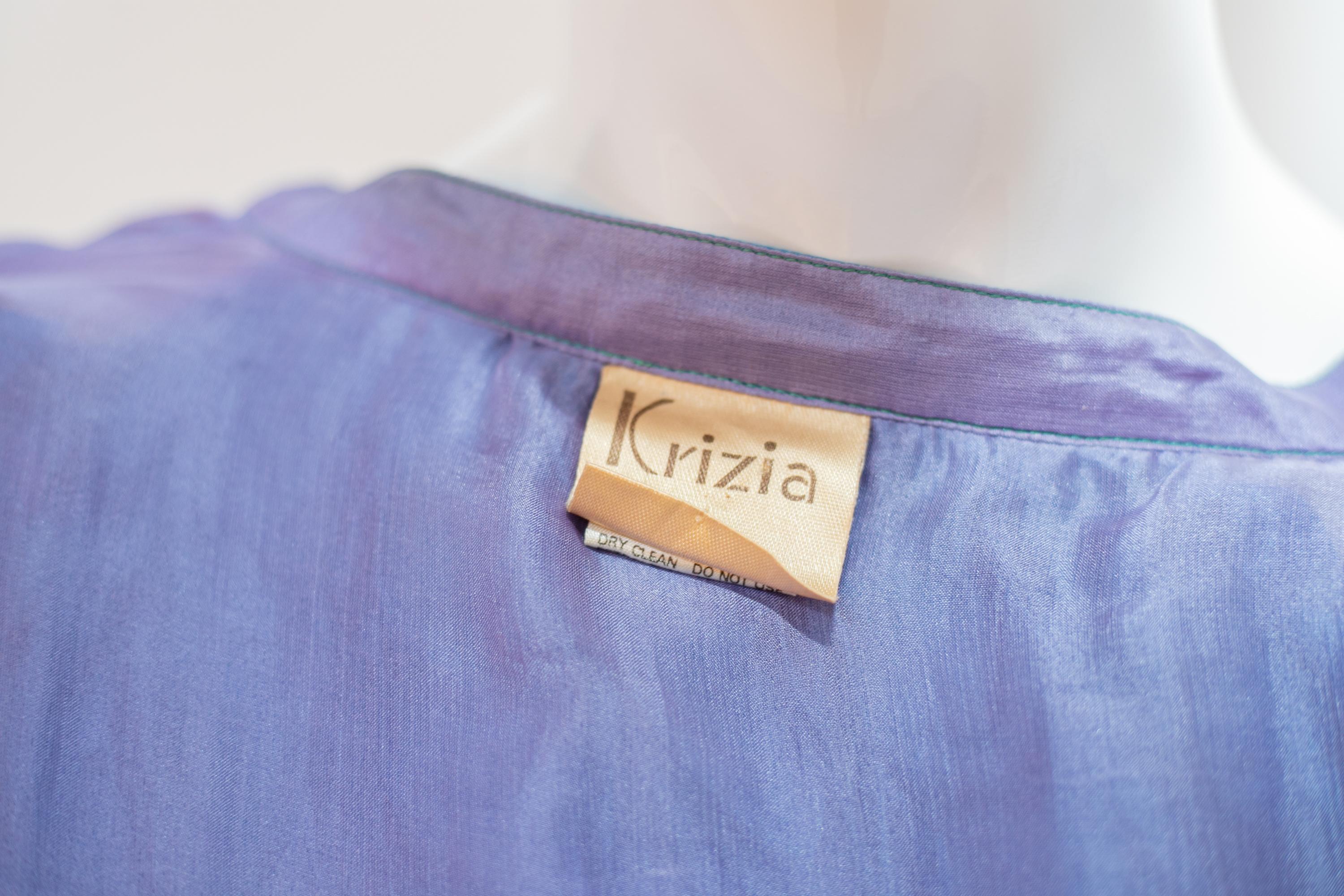 Fluttering vintage silk blouse from the 1990s by Krizia, made in Italy.
ORIGINAL LABEL.
The blouse is totally made of light blue silk with long sleeves with narrower cuffs, creating a beautiful butterfly effect. The collar has the classic standard