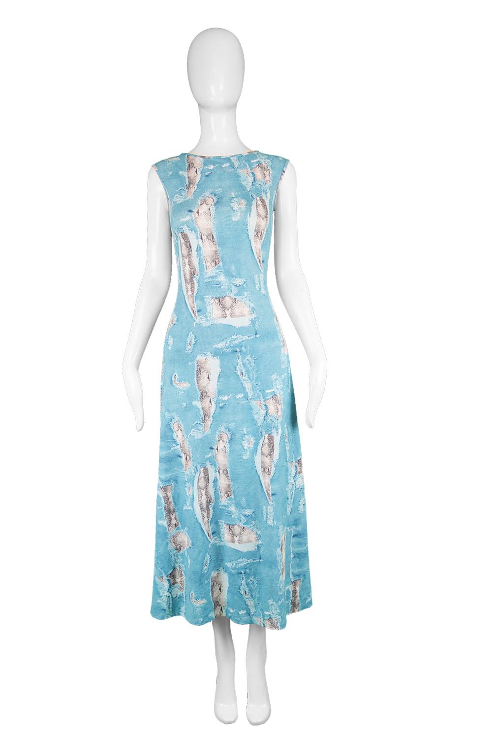 An edgy vintage dress from the 90s by luxury Italian fashion house, Krizia. In a light blue stretch jersey fabric with a trompe l'oeil print of torn denim and snakeskin pattern throughout. The stretchy elastane means the jersey clings to your curves