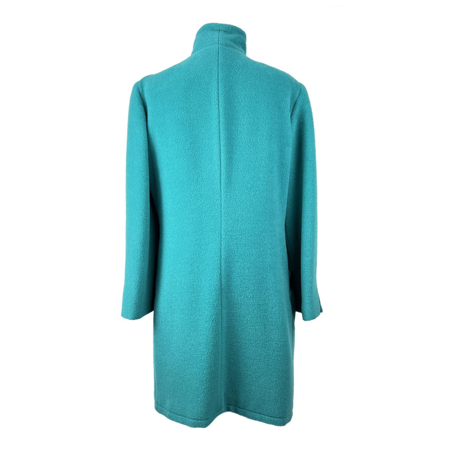 Vintage Krizia turquoise coat. Funnel neckline. Long sleeve styling with buttoned cuffs. Front button closure. 2 waist pockets. Lined. Composition: 50% alpaca, 30% mohair, 20% wool. Size: 40 IT

Details

MATERIAL: Wool

COLOR: Turquoise

MODEL: