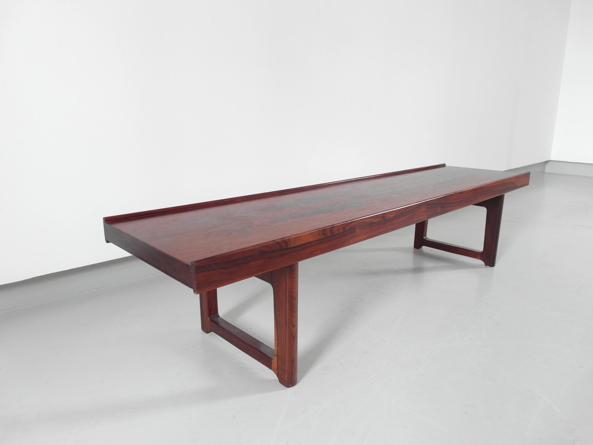 Vintage rosewood Krobo bench designed by Torbjørn Afdal, produced by Bruksbo, Norway 1960.
In 1960 Torbjørn Afdal designed this multipurpose Krobo bench. It became an instant Classic because of its unique flexibility and many uses. This is for a