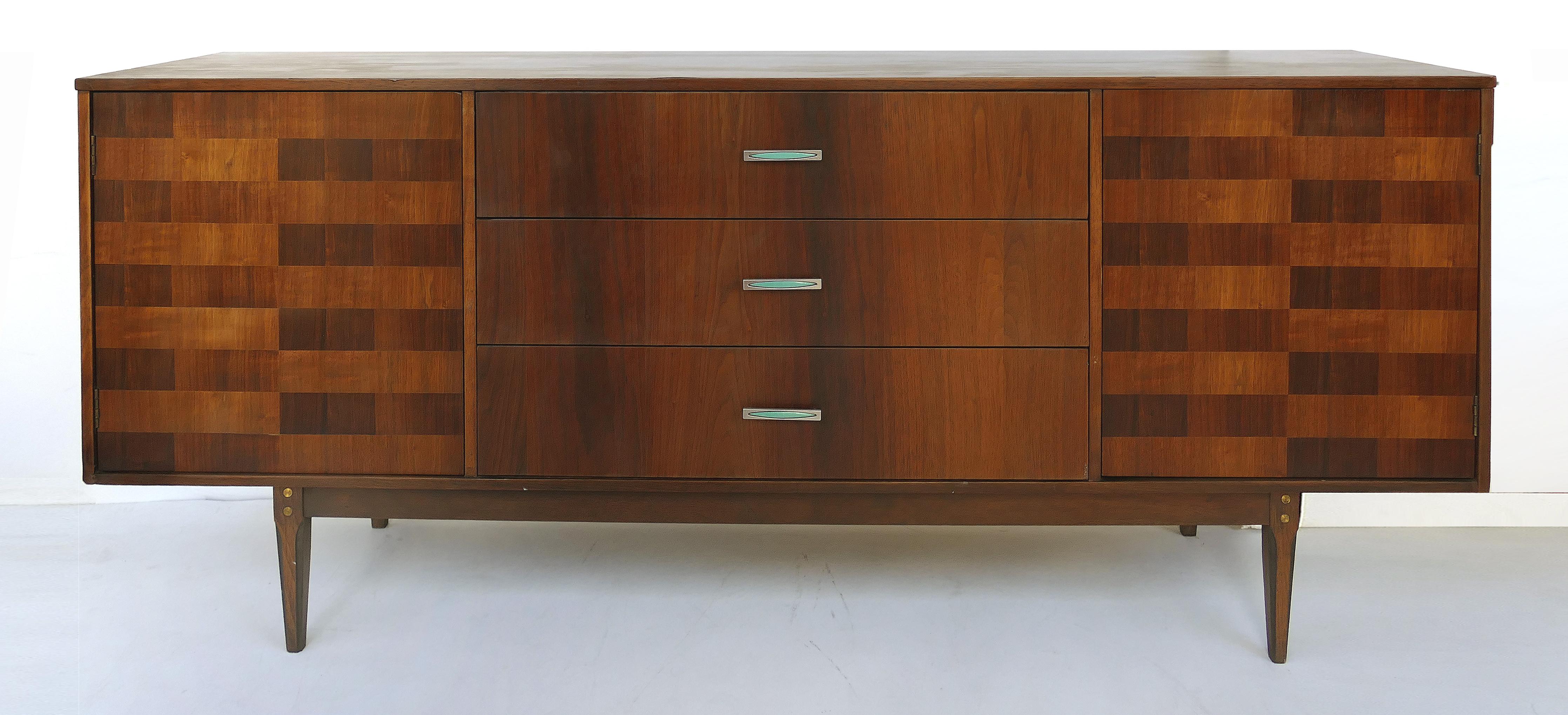 Kroehler custom crafted credenza with rosewood inlays and enameled brass hardware

Offered for sale is a fine Kroehler custom-crafted credenza with rosewood inlays and wonderful enameled brass hardware. The three central drawers are flanked by two