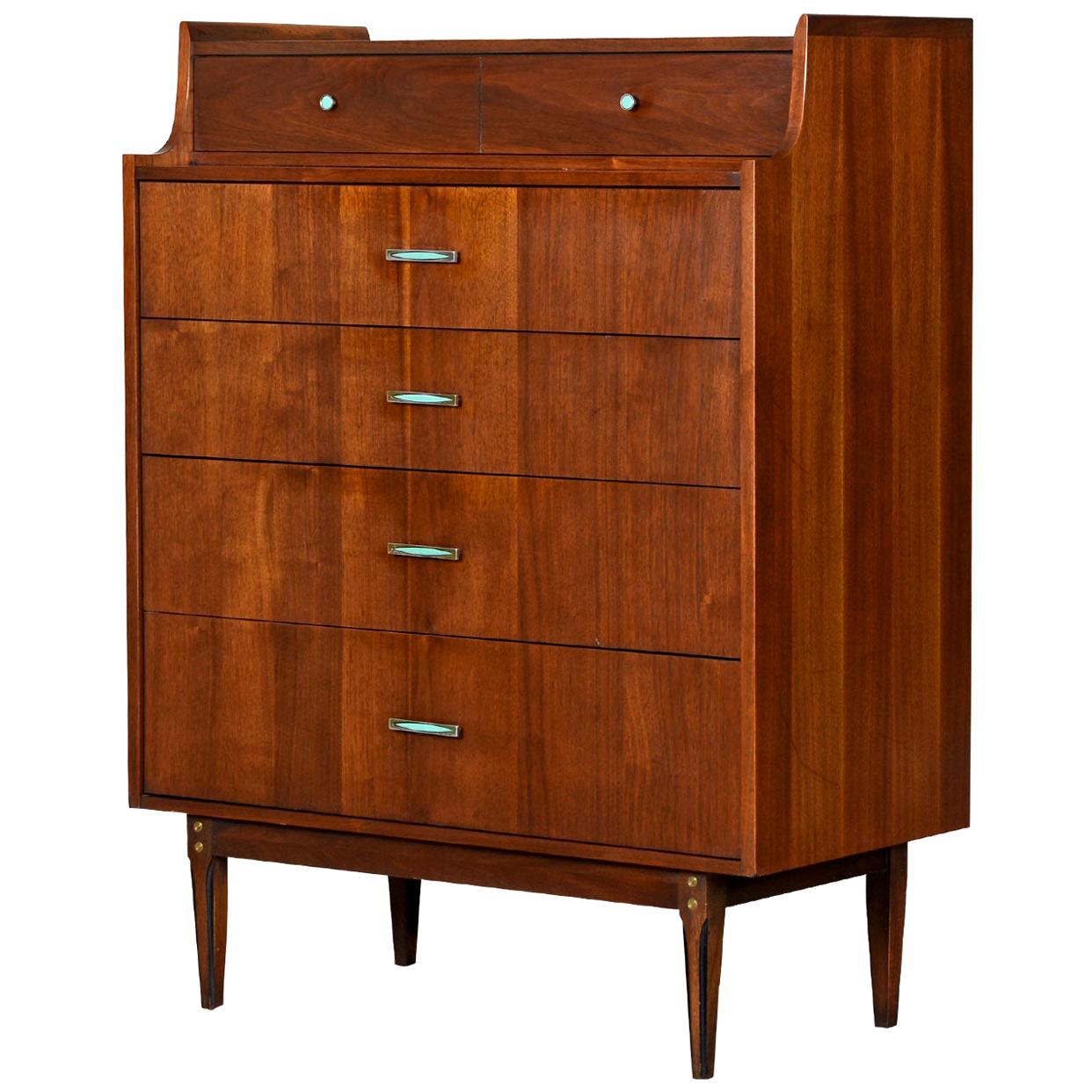 Kroehler has pulled out all the stops with this stunning high boy. A profile view highlights the unique stepped upper tier with an elegantly contoured rise. The top of the dresser is punctuated with “bat ear” tips in front. Look closely at the super