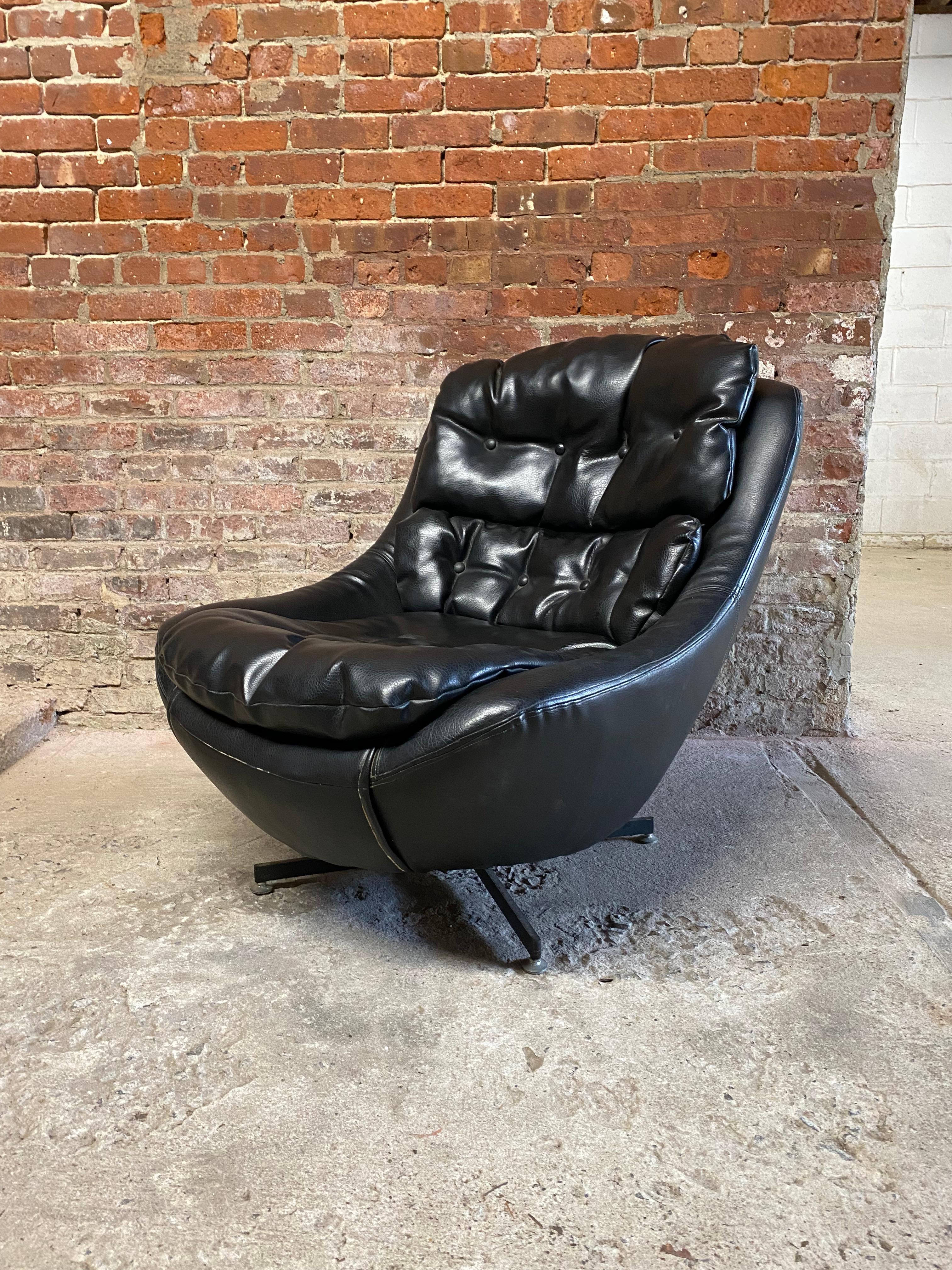 Koehler Signature Design black swivel bucket chair. Original black vinyl/naugahyde upholstery. Removable three part seat and back cushion. There is an extra cushion included upon purchase. Black steel base. Circa 1960-70. Extremely comfortable and