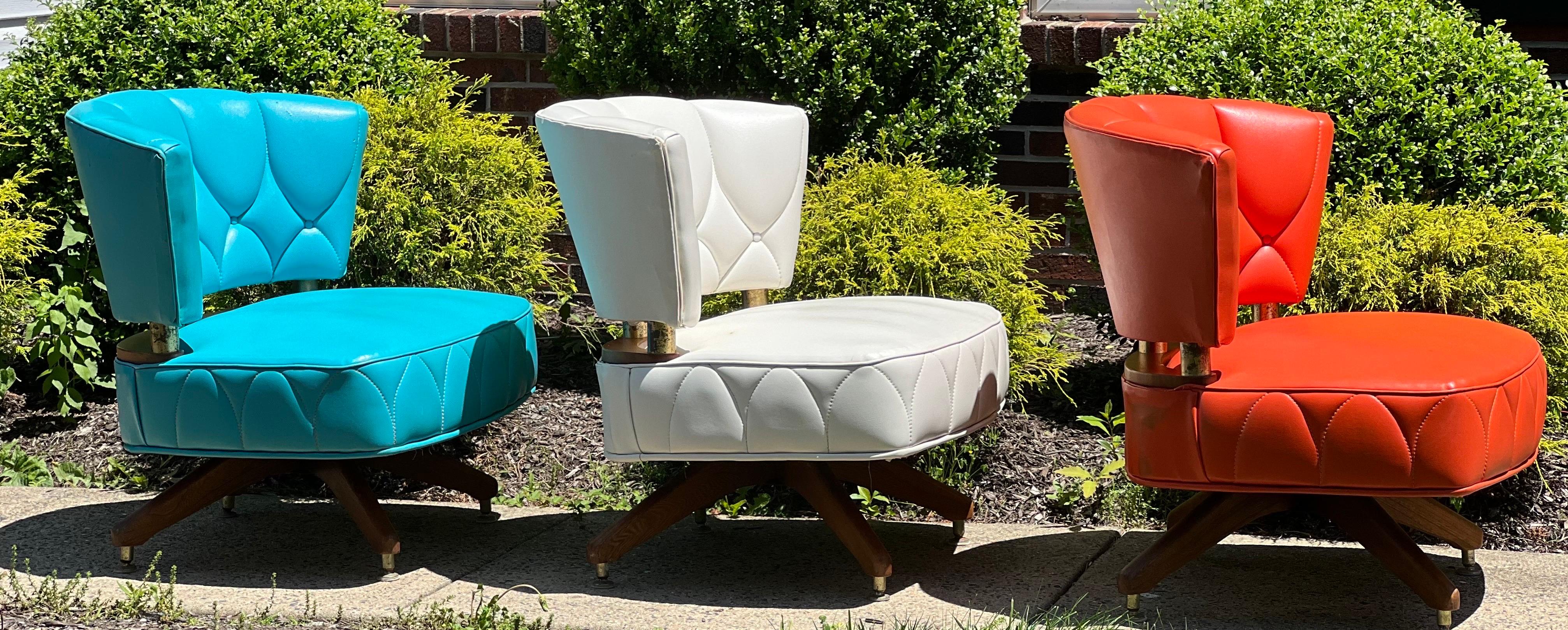 Fabulous, unique set of vintage Kroehler swivel slipper chairs, 1962. 

Offered as the original set of three boldly colorful chairs. They look stunning together and would be fantastic in a single space. The generous seats are very comfortable and