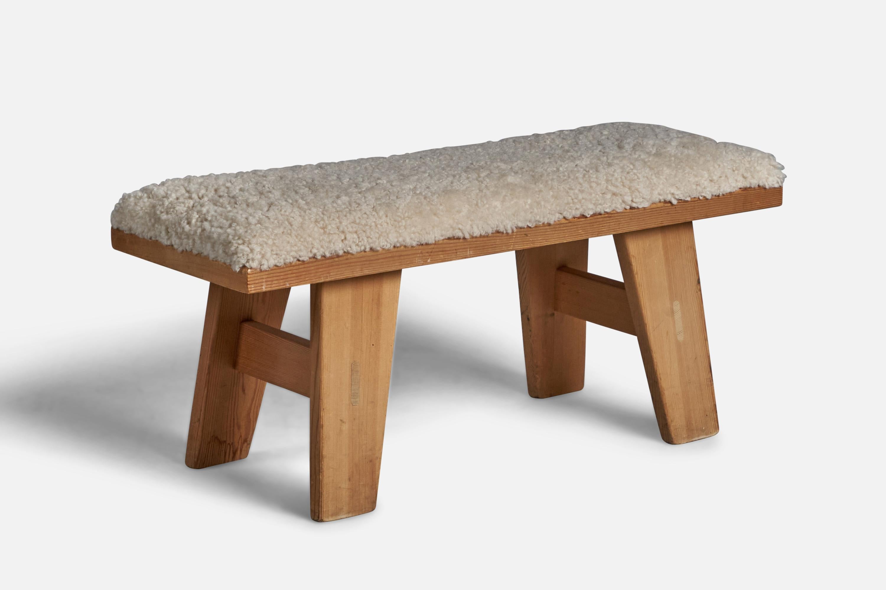 A pine and beige shearling bench designed and produced by Krogenæs Møbler, Norway, 1970s.

With makers mark branded to underside.