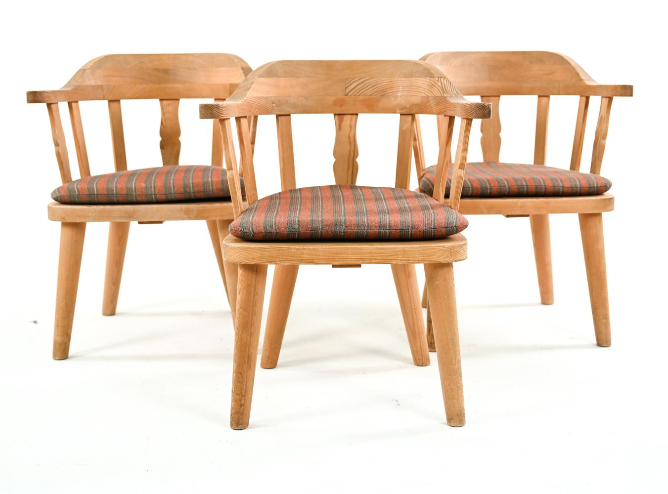 Marked underneath table and chairs: Krogenæs Møbler. A Norwegian modern set of three pine chairs with removable cushions and a petite round table, c. 1970's.