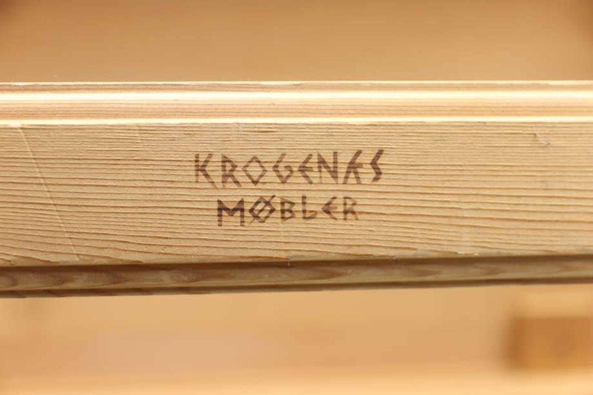 Krogenäs Möbler of Norway pine coffee table ca 1960. Simple yet distinctive Scandinavian coffee table in luminous unfinished pine, designed by Norwegian firm, Krogenäs Møbler. Designer authenticity is fire-branded on piece. Table is as sturdy and