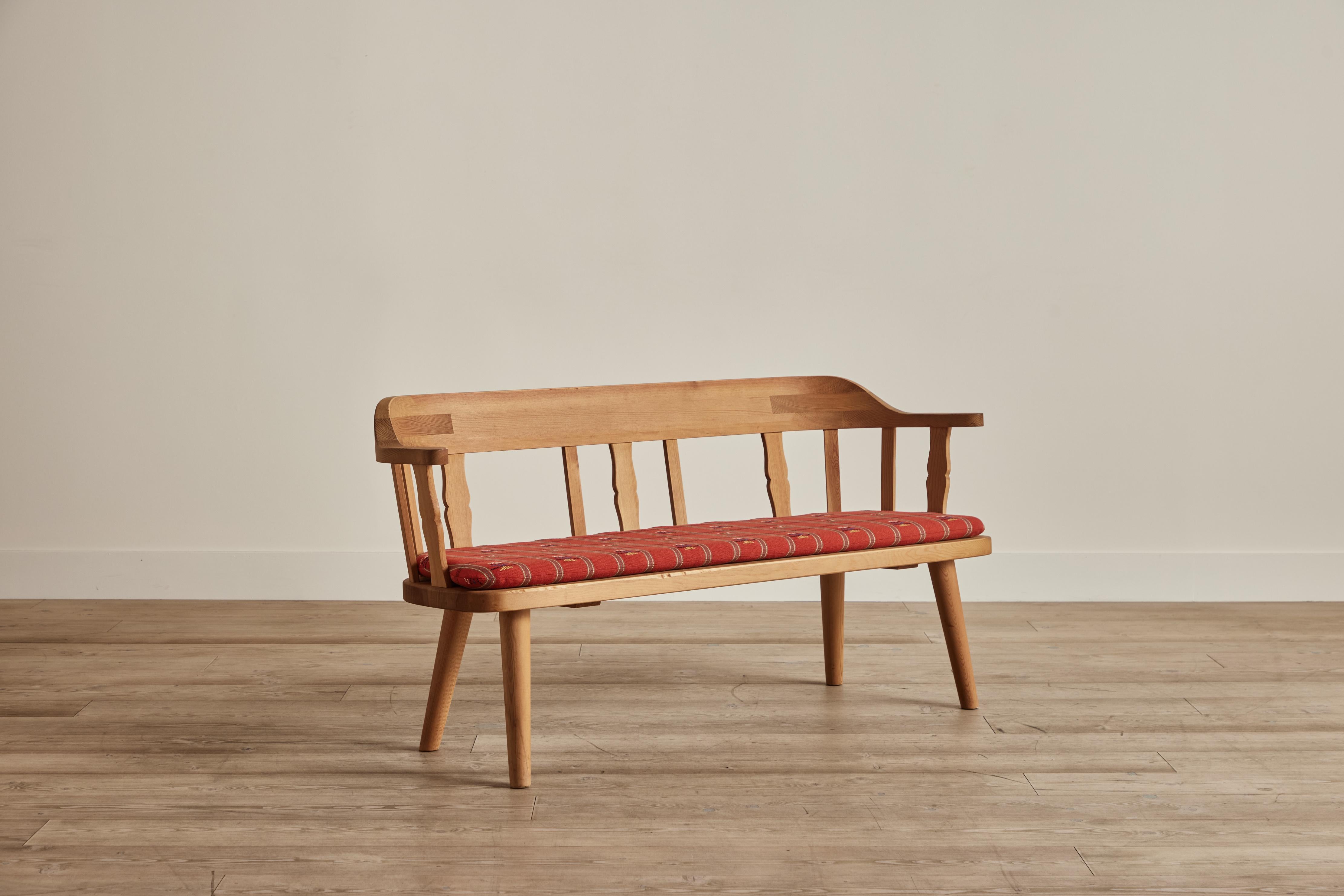 Pine bench with original fabric cushions by Krogenäs Möbler from Norway circa 1970. Some wear on pine wood that is consistent with age and use.