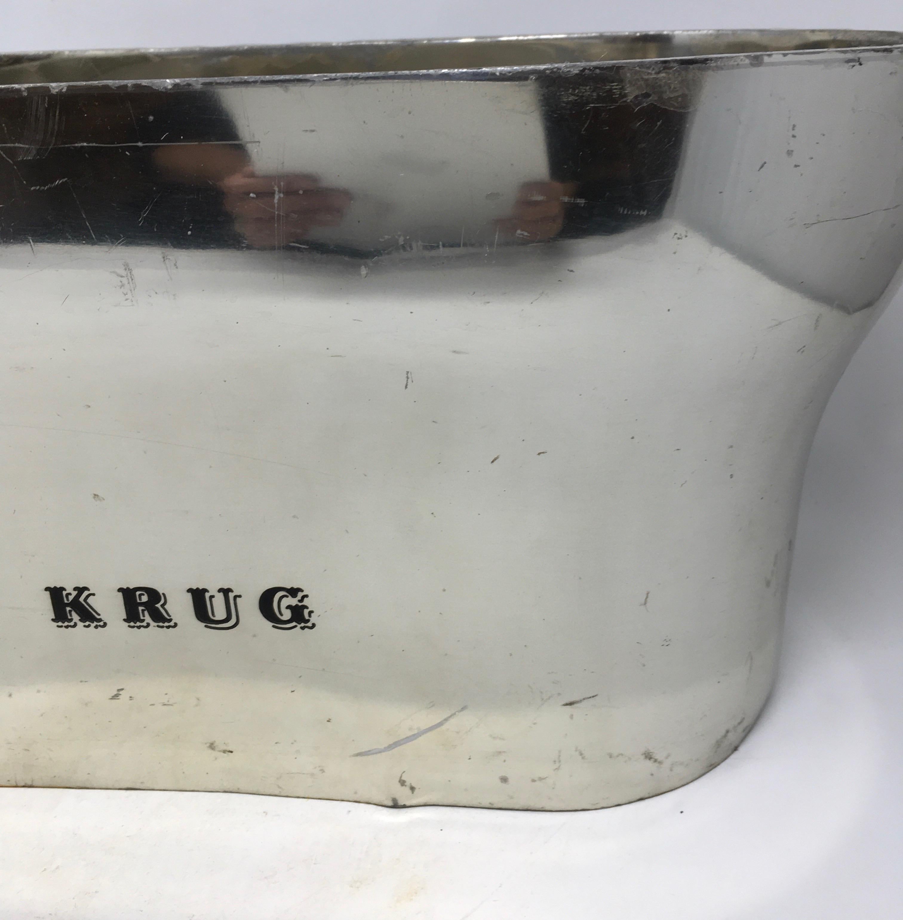 A fabulous double or magnum cooler from the house of Krug to hold and chill your champagne or other wines. A lovely piece to use and display in your bar.
This piece weighs 11 lbs.
