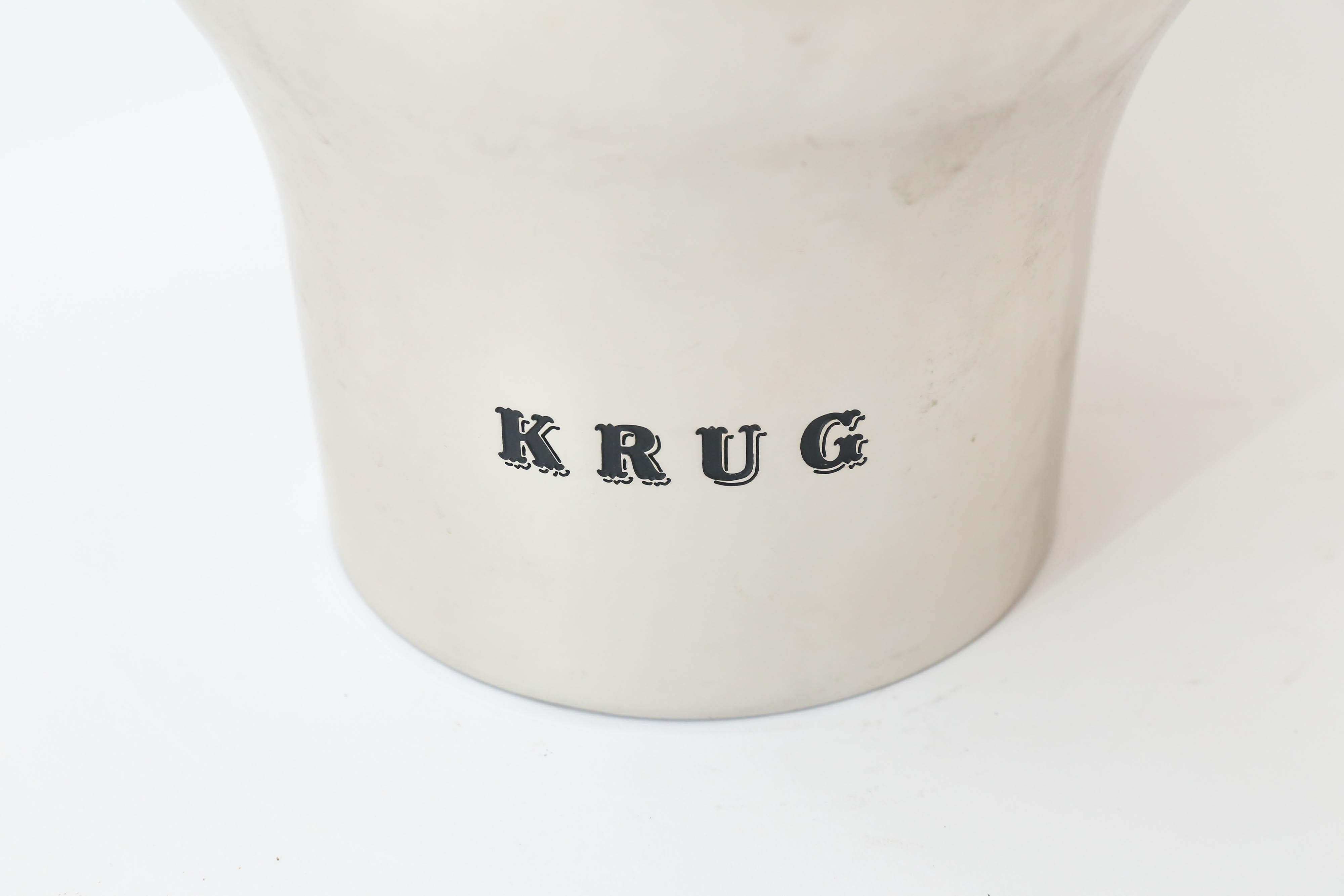 A fabulous cooler from the house of Krug to hold and chill your champagne or other wines. Designed by Francois Bauchet and featuring his signature on the underside. A lovely piece to use and display in your bar.