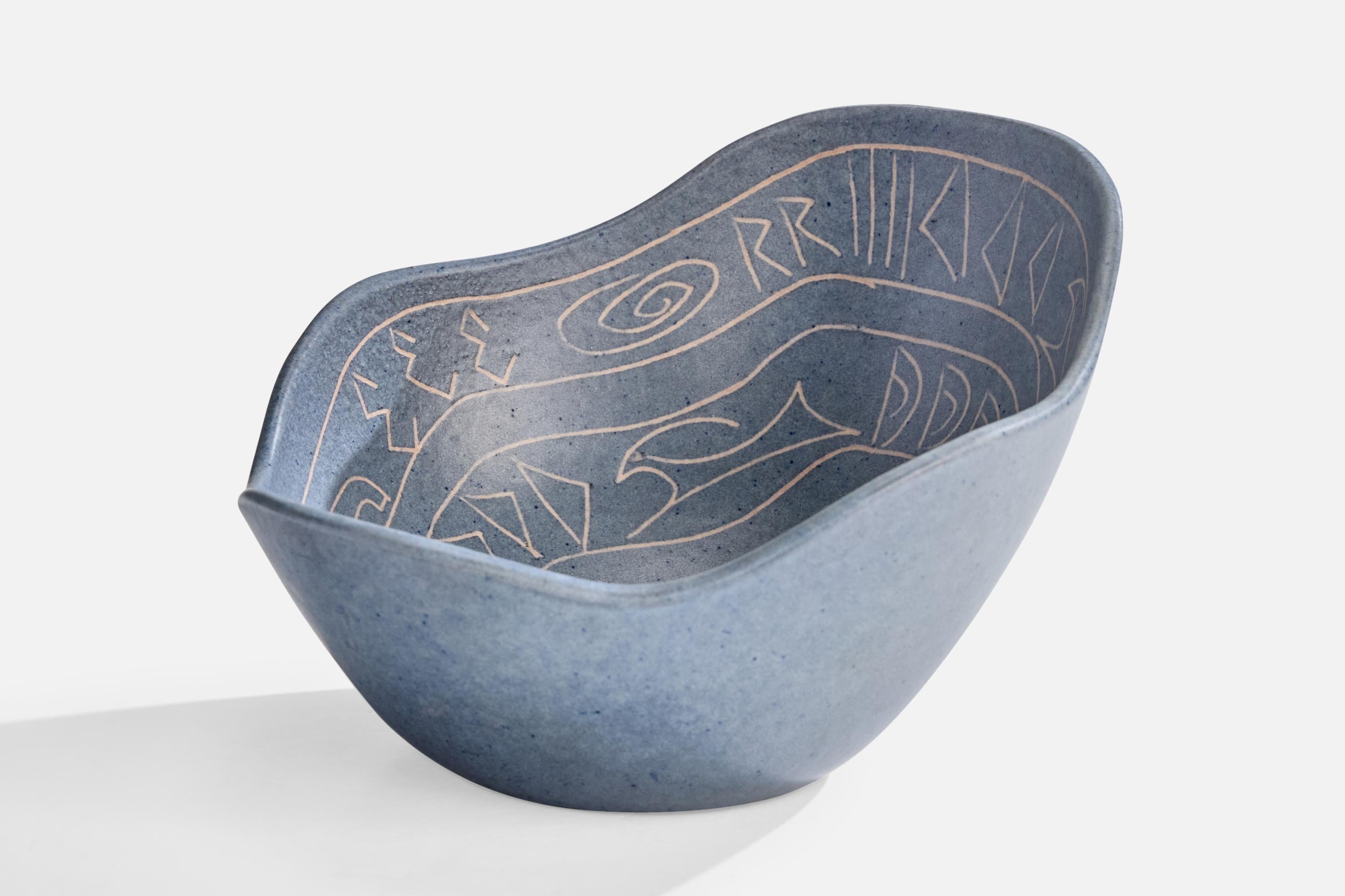 An organic blue-glazed ceramic bowl produced by Krukmakaren I Ystad, Sweden, c. 1950s.

Overall Dimensions (inches): 4.0