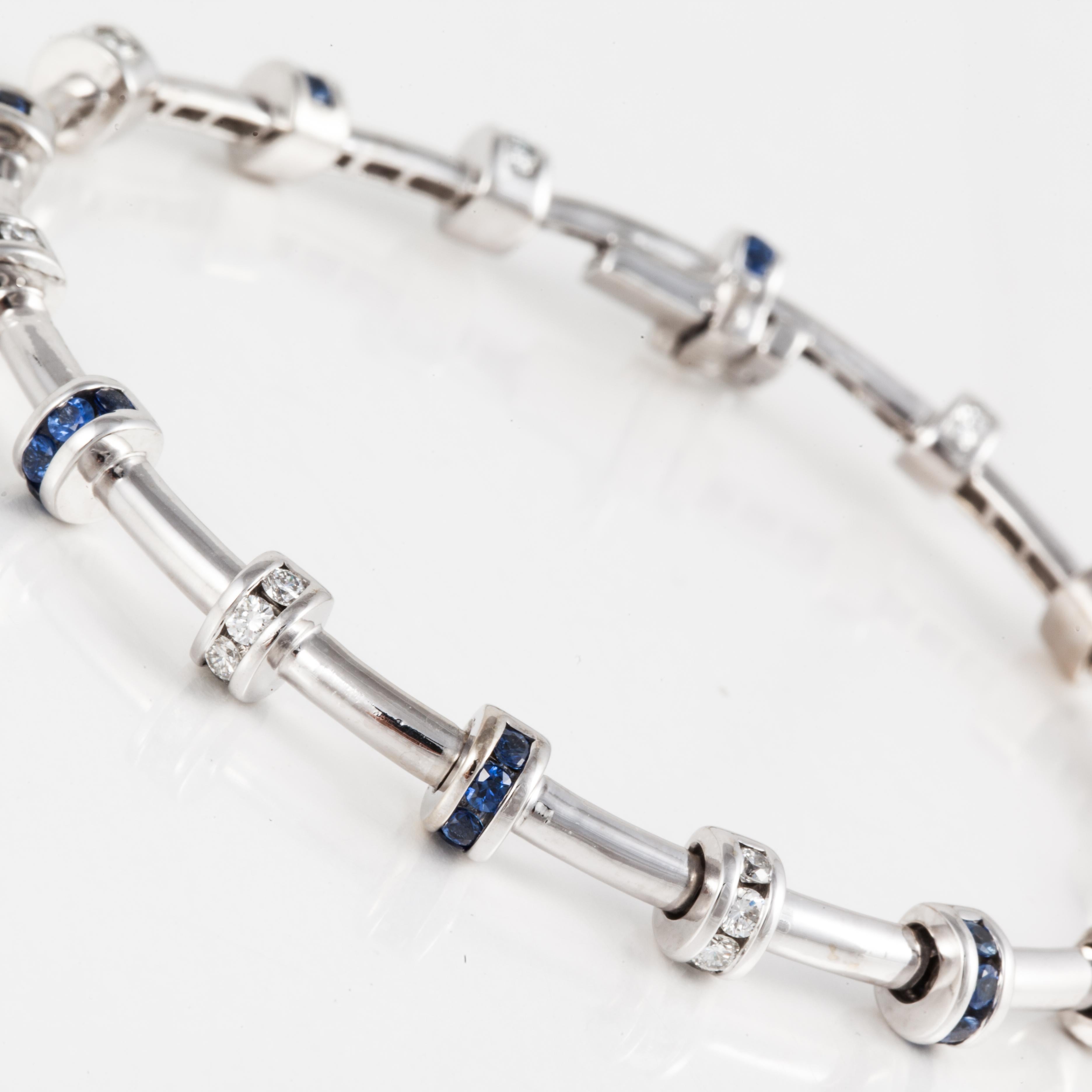 Bracelet by Charles Krypell is 18K white gold featuring diamonds and sapphires.  The bracelet is marked 