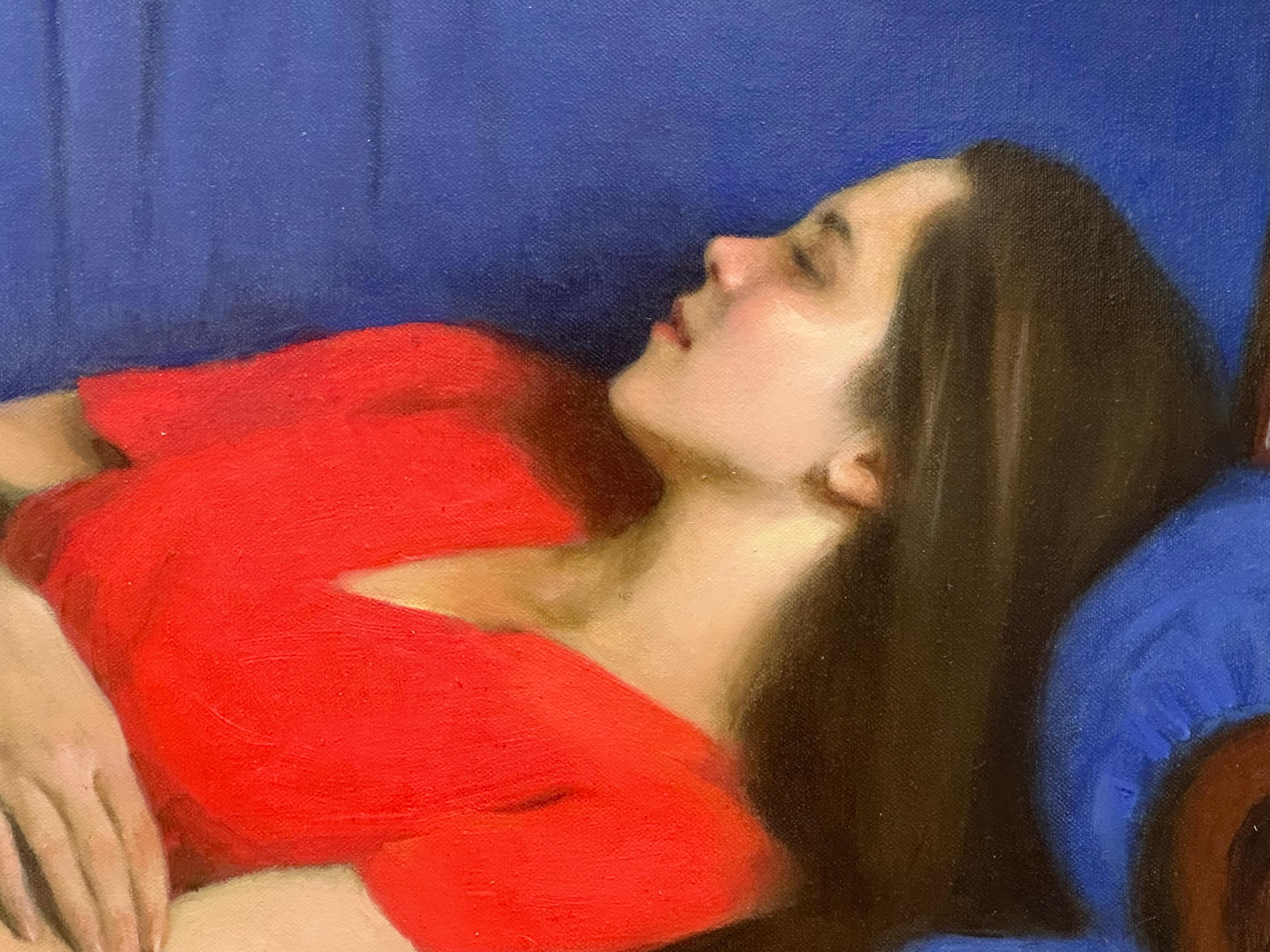 Midday nap- 21st century painting of a girl in a red dress on a blue sofa - Contemporary Painting by Ksenya Istomina