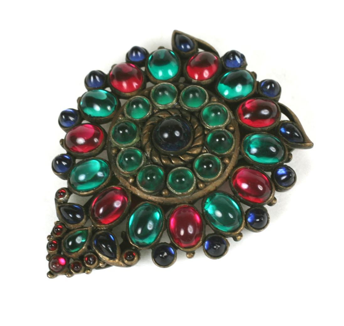 KTF Jewels of India, Trifari by Alfred Philippe 1930's shield shape crest dress clip brooch. Of jewel tone bezel set, vari shaped faux emerald, ruby and sapphire poured glass hand polished cabochons. The detailed setting of base metal plated in a