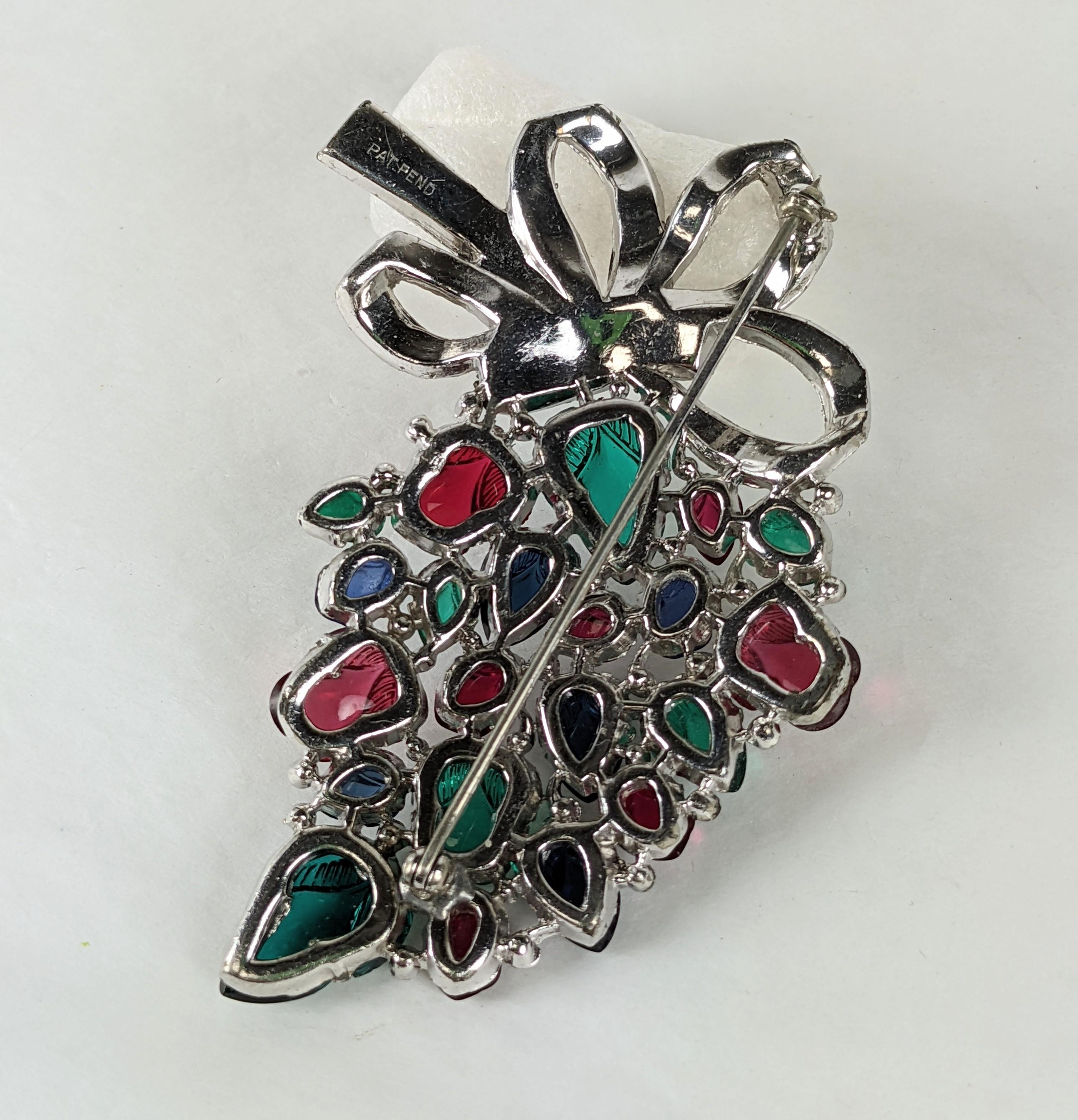 Rare and collectible KTF Trifari Alfred Philippe tricolor fruit salad Bouquet brooch with crystal pave and channel set baguette looped bow. Of rhodium plated base metal, crystal rhinestones and baguettes with emerald , ruby and sapphire fruit salad