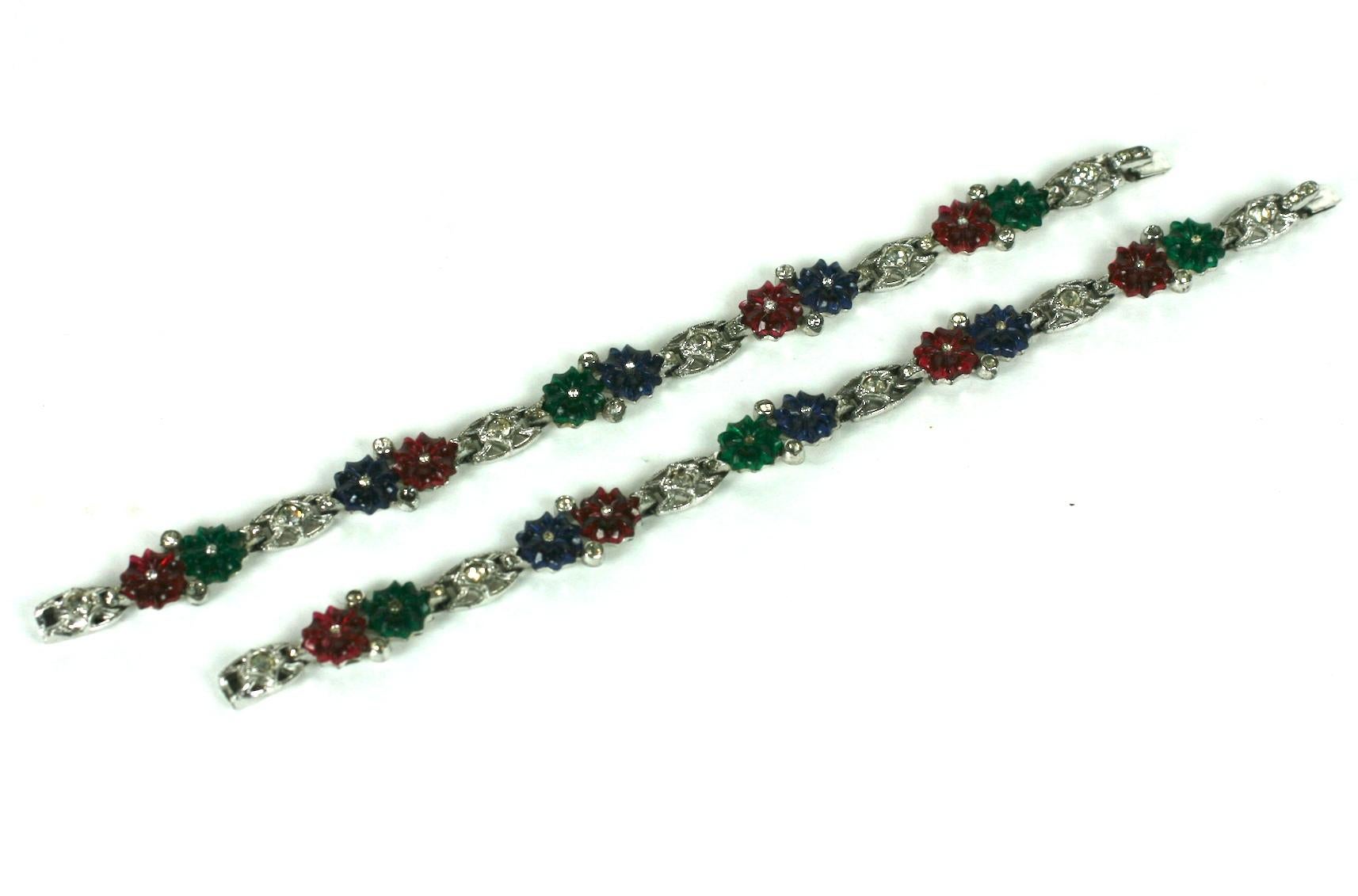 KTF Trifari Alfred Philippe Tricolor fruit salad flower bracelets. Composed of ten stations of rhodium plated base metal with crystal rhinestones and faux ruby, emerald and sapphire pressed and hand finished fruit salad flowers.
Excellent Condition,