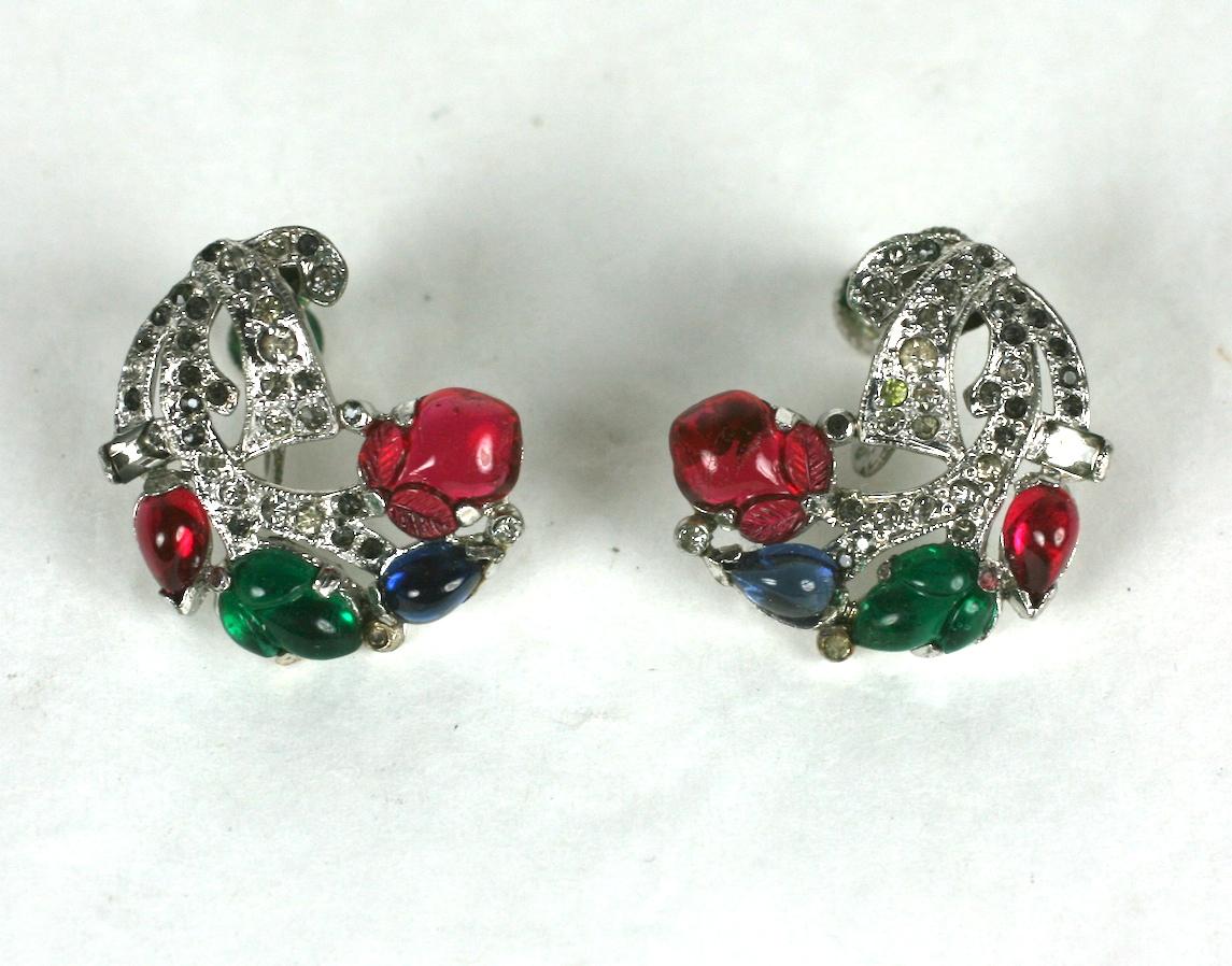 KTF Trifari Alfred Philippe tri color Art Deco pave swirl earclips . Of  faux ruby ,sapphire and emerald  pressed glass fruit salad andpear shape  cabocheons  set in rhodium plate base metal with crysXal rhinXsXone pave 
 
 Excellent Condition,