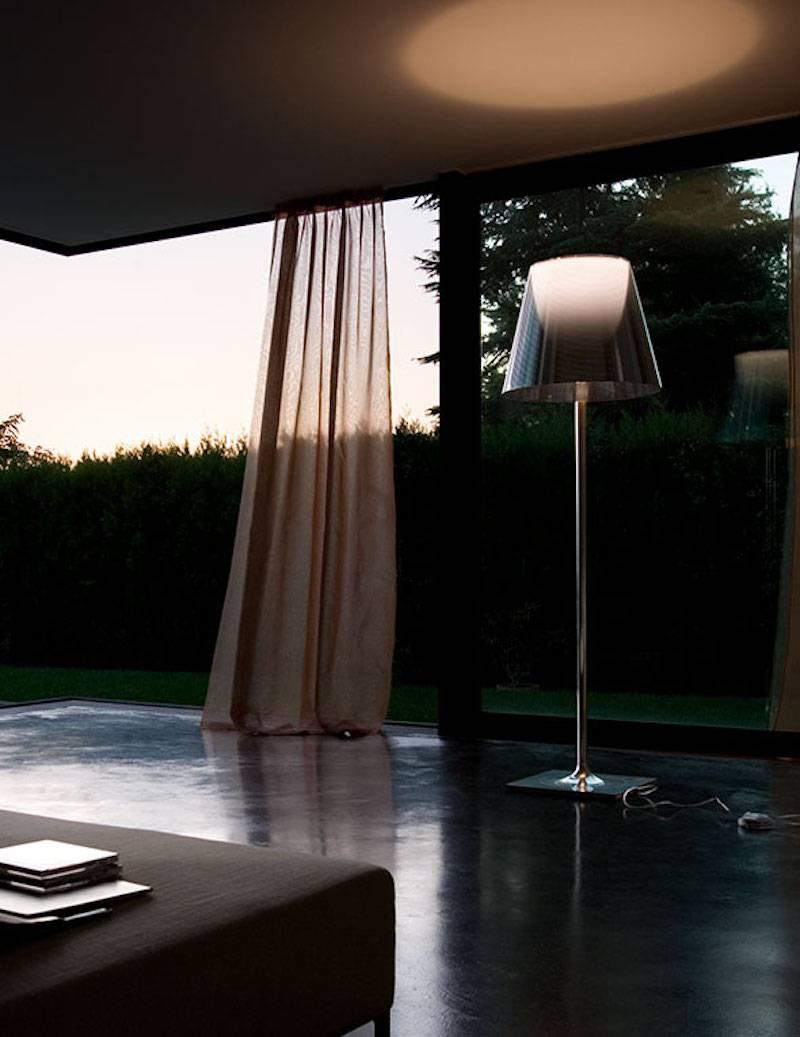 Ktribe F3 Floor Lamp designed by Philippe Starck for Flos in Fumee Finish. 

Subtle yet striking, the KTribe-F floor lamp provides diffused light through a transparent diffuser that gracefully moves the eye upward. The base, rod support, and