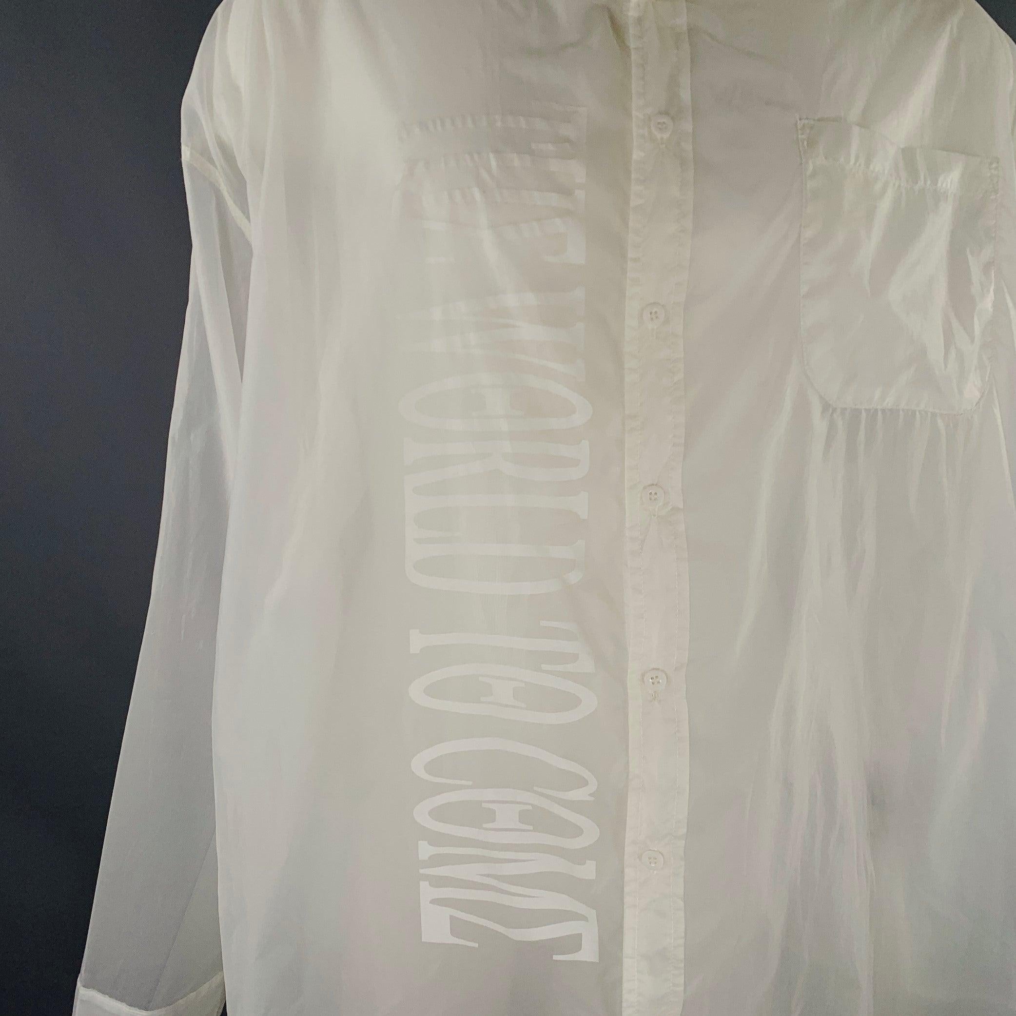KTZ long sleeve shirt
in a white nylon fabric featuring an oversized style, white-on-white graphic print, one pocket, and button closure.Excellent Pre-Owned Condition. 

Marked:   M 

Measurements: 
 
Shoulder: 27 inches Chest: 61 inches Sleeve:
