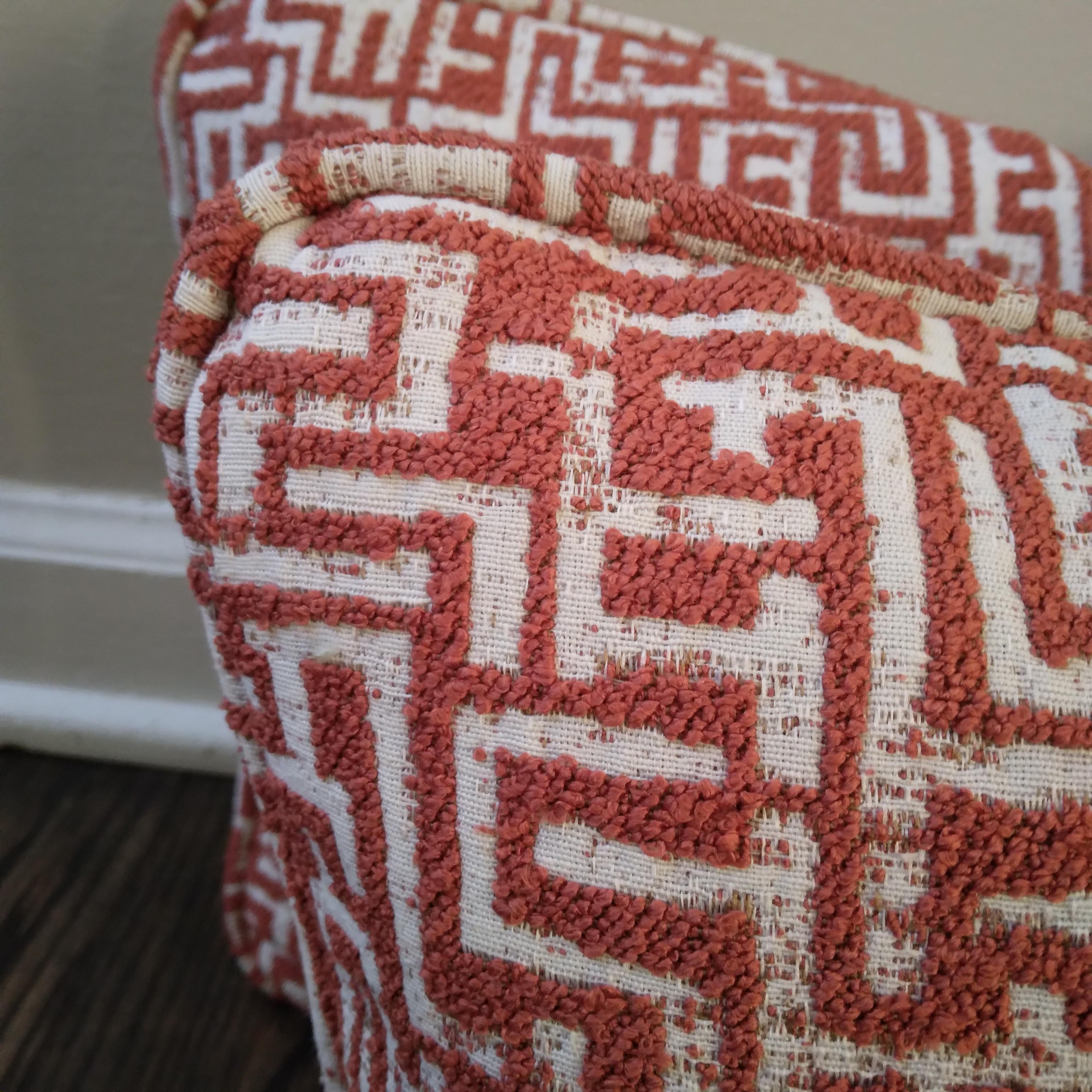 Eclectic and vibrant, these Kuba-inspired, geometric throw pillows are the perfect way to add rich color and chunky texture to your living spaces. Nubby, interconnecting lines of woven textile create an eye-catching effect. The saturated orange is
