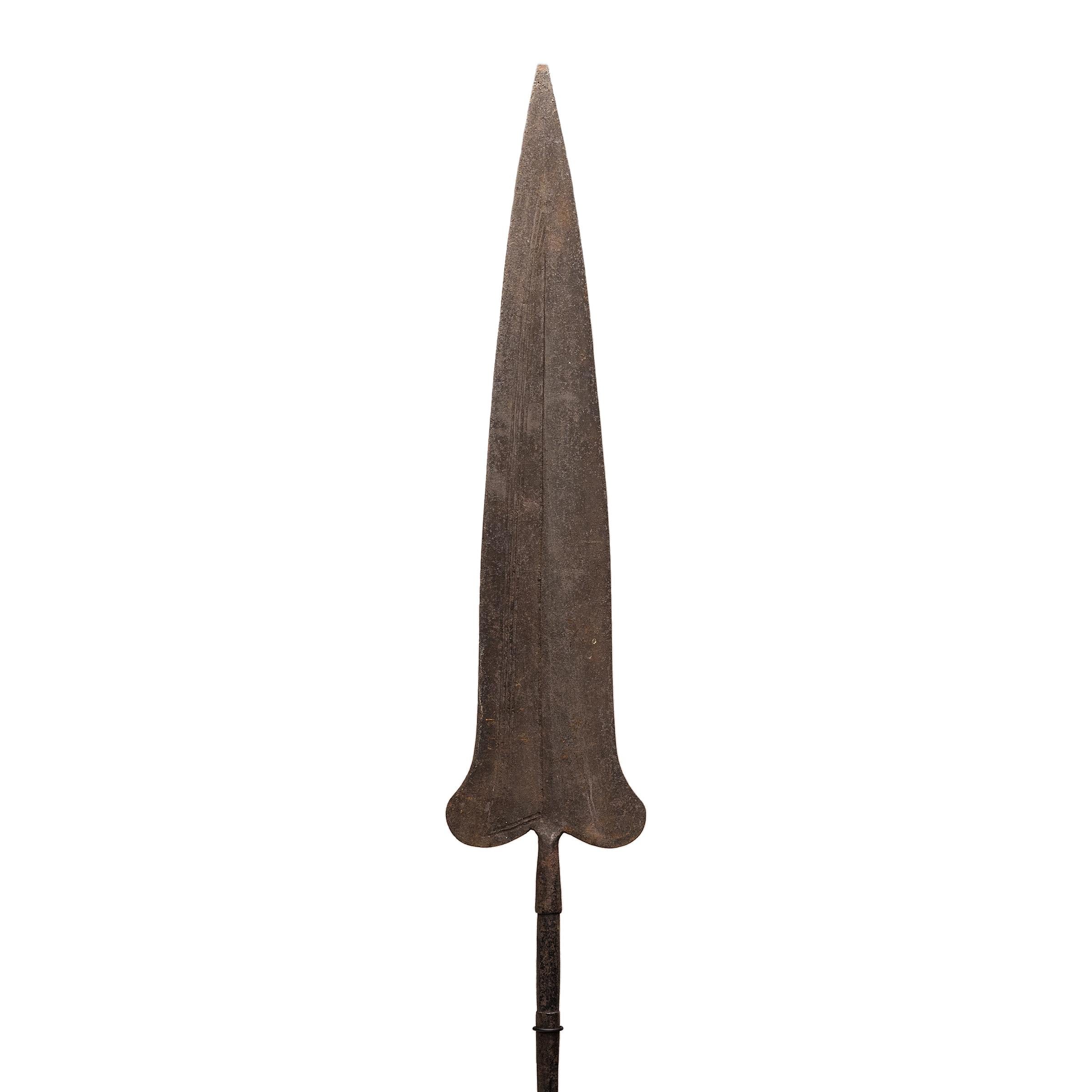 While shield and spear were central to African combat, this iron example was most likely made to serve as a piece of trade currency. Many pre-colonization African currencies were modeled after objects of inherent value, resulting in sculptural