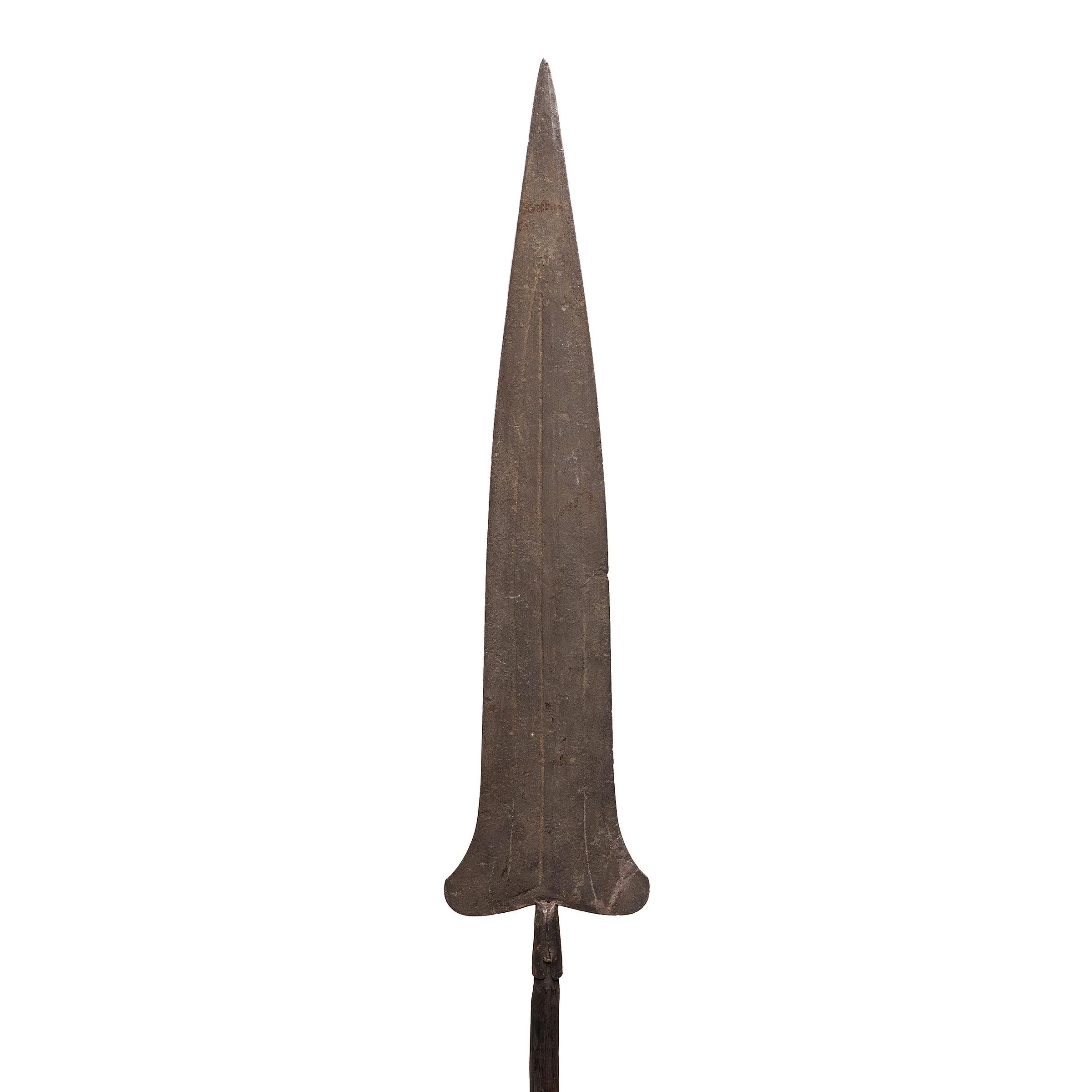 While shield and spear were central to African combat, this iron example was most likely made to serve as a piece of trade currency. Many pre-colonization African currencies were modeled after objects of inherent value, resulting in sculptural