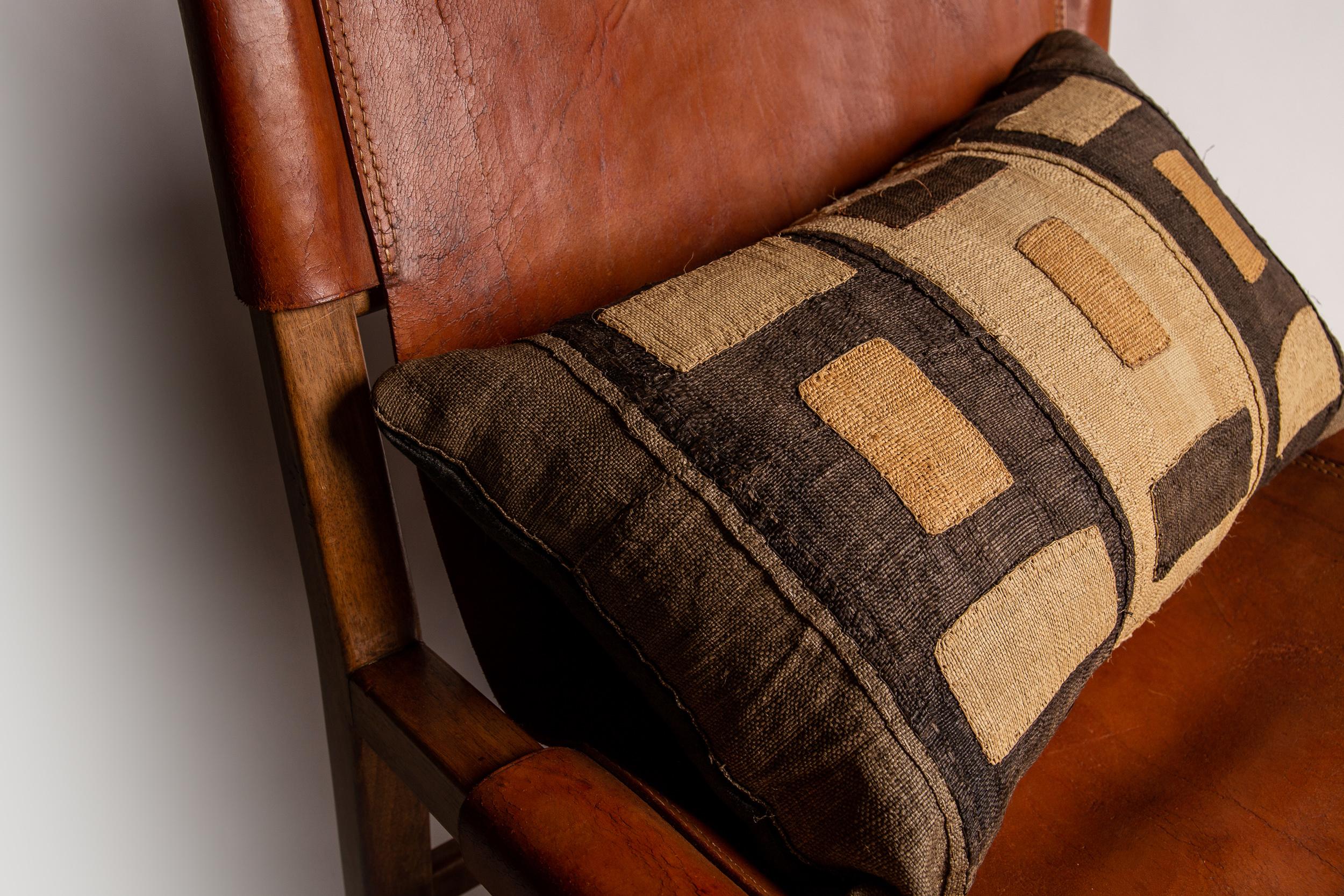 Vintage Kuba textile (circa 1940) feather filled cushions, made from handwoven palm leaf fibre enhanced by geometric designs executed in a linear/graphic embroidered design. 

Handmade by Toad featuring a luxurious dark grey mohair to the reverse