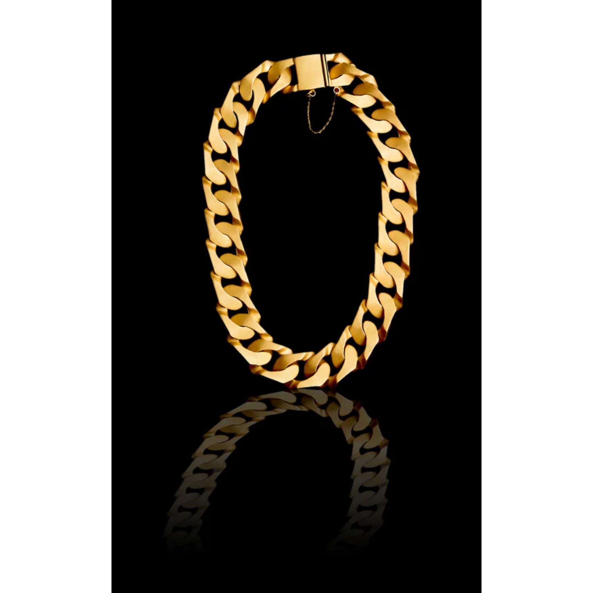 A sexy, substantial Cuban chain necklace to take you from day to night, all handmade. This iconic, statement, classic jewel has been made oversize and includes a safety chain so you will never lose it! Select your gold finish and the cuff that