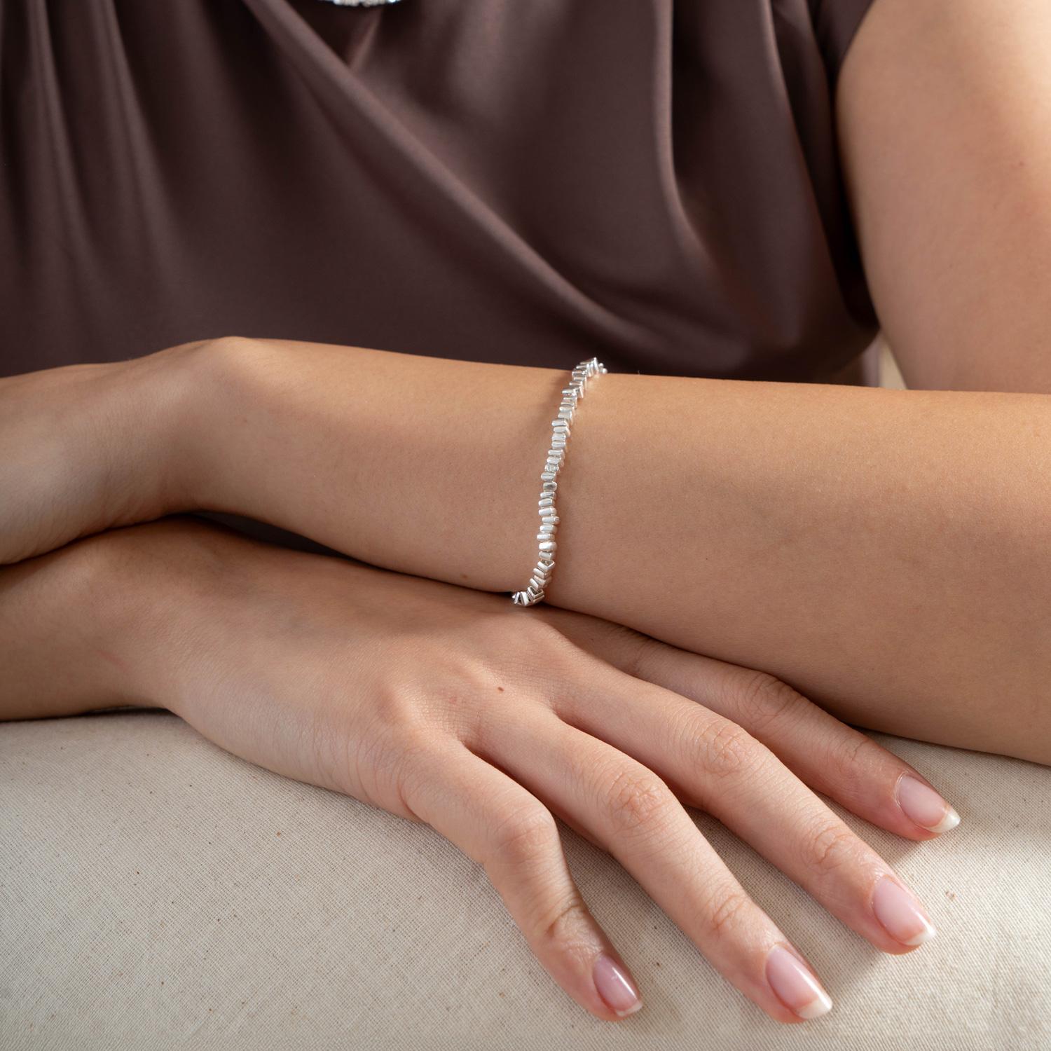 A timeless classic and great for layering, this much-loved design has been revived from our archives. Guaranteed to elevate any outfit, the sterling silver bracelet is handcrafted in our London studio and made from small square 'kube' beads threaded