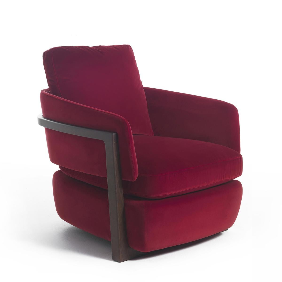 Armchair Kuda with structure in solid walnut 
wood in polished and matte varnished finish.
Upholstered and covered with high quality 
fabric in deep red color.
Also available with other fabrics on request.
 